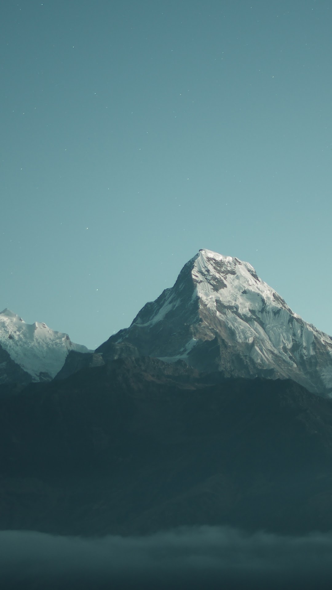 Snow-capped mountains under a clear sky HD Phone Wallpaper
