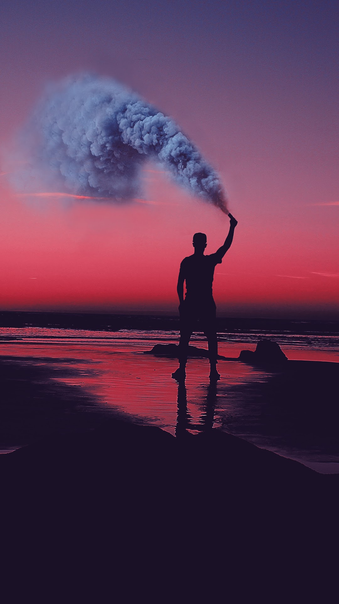 Silhouette with Smoke Flare on Beach at Sunset HD Phone Wallpaper