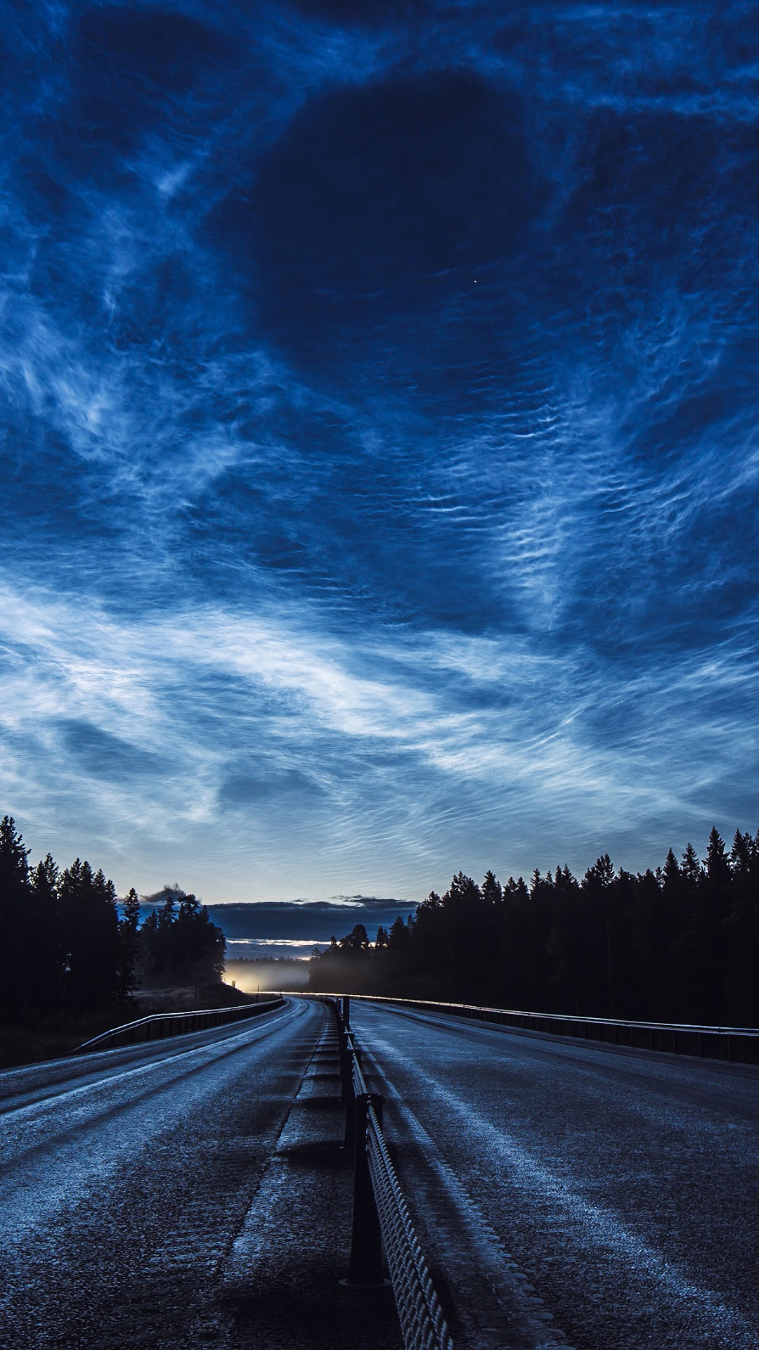 Noctilucent clouds over a road and forest HD Phone Wallpaper