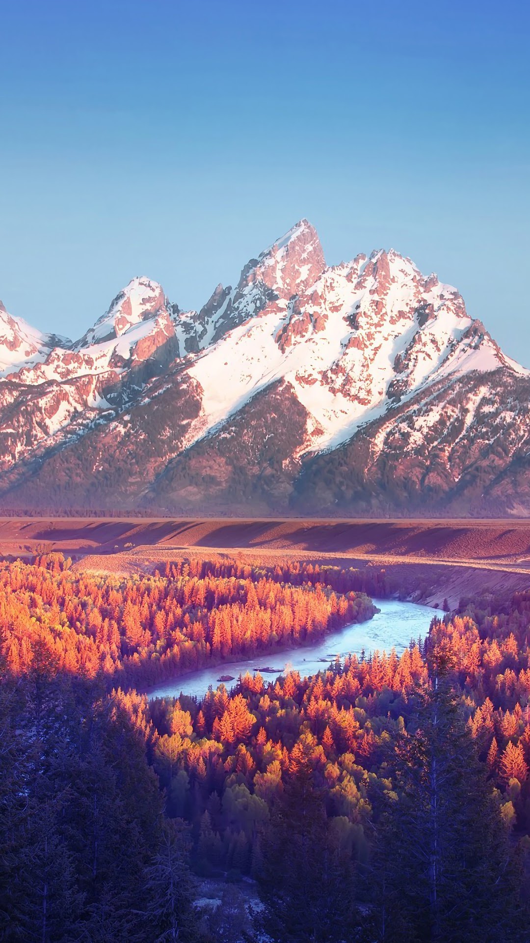 Snow-capped mountains over a colorful forest and river HD Phone Wallpaper