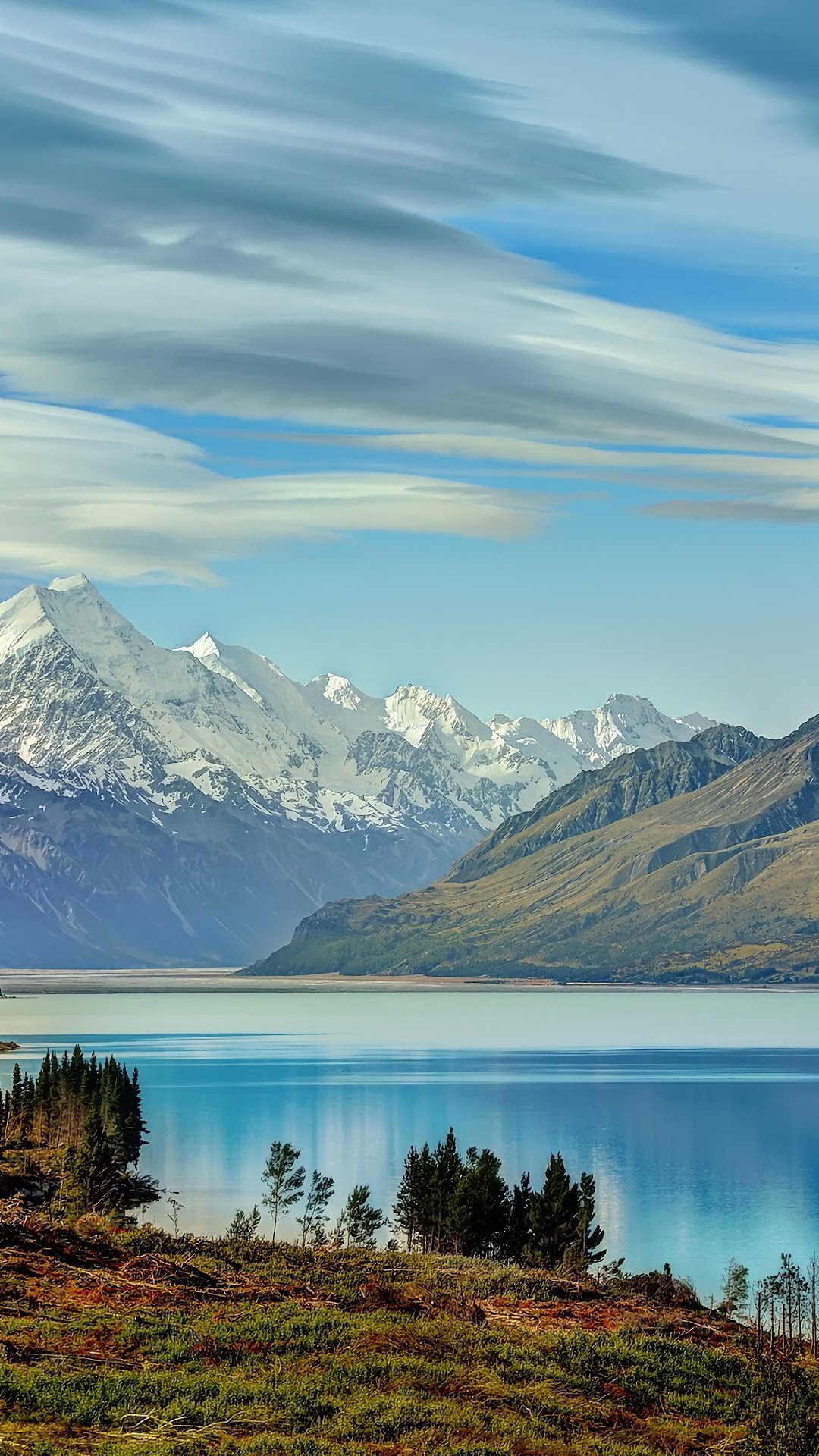 Snow-capped mountains reflected in a clear lake HD Phone Wallpaper