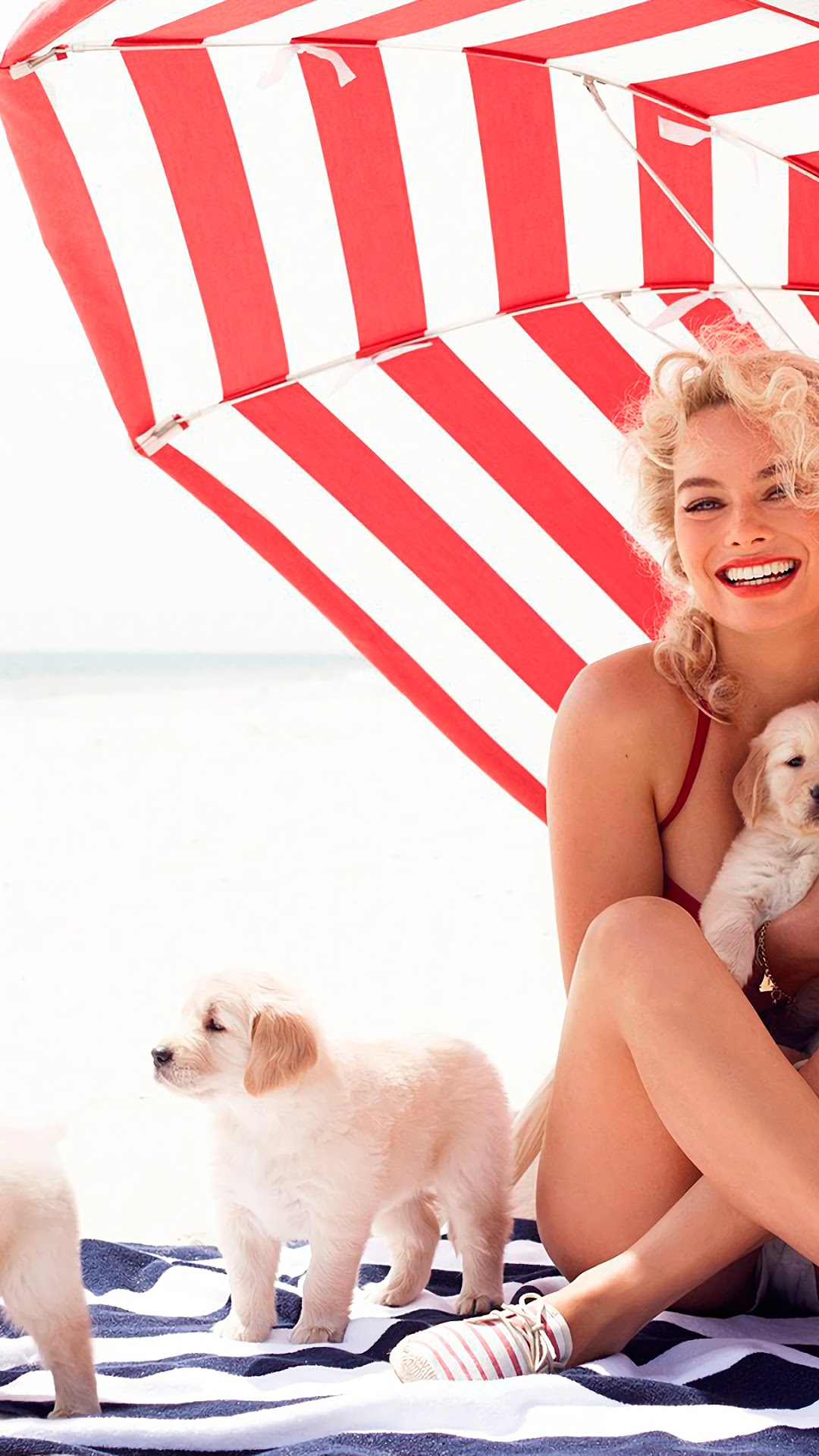Margot Robbie with puppies on the beach HD Phone Wallpaper