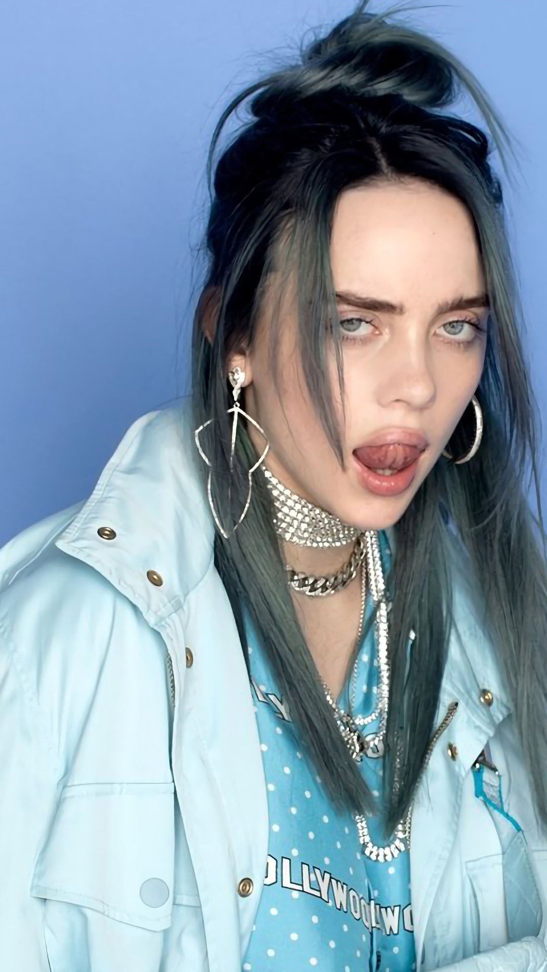 Billie Eilish with blue shirt and jacket HD Phone Wallpaper