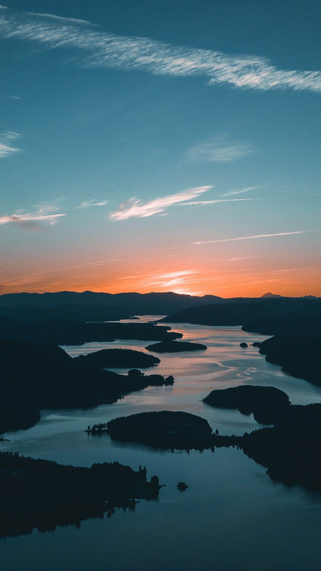 Sunrise over a lake with islands and mountains HD Phone Wallpaper
