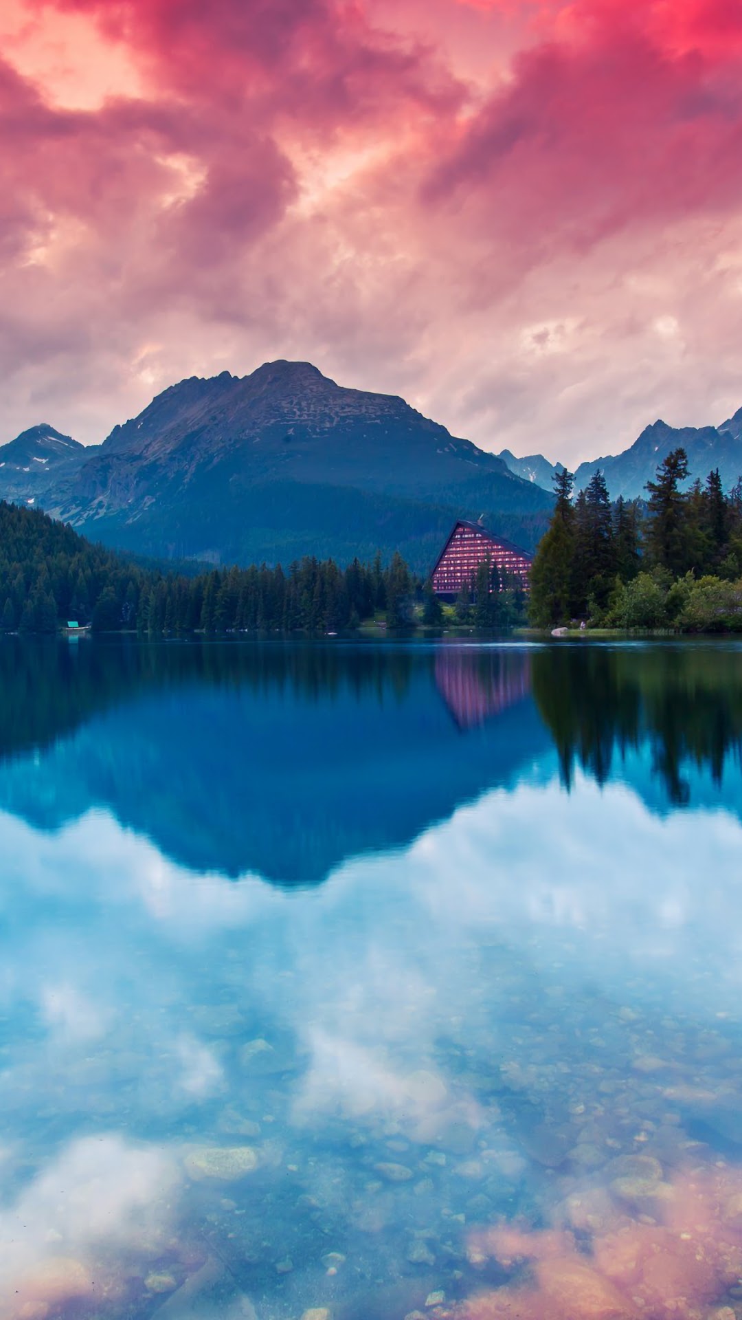 Lake and mountains with a building and forest HD Phone Wallpaper
