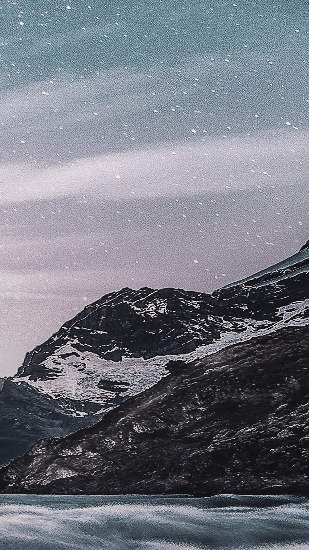 Snowy mountains overlooking a body of water under a starry sky HD Phone Wallpaper