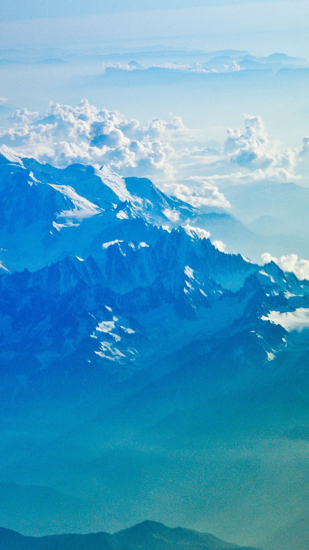 Snow-capped mountains and clouds from above HD Phone Wallpaper