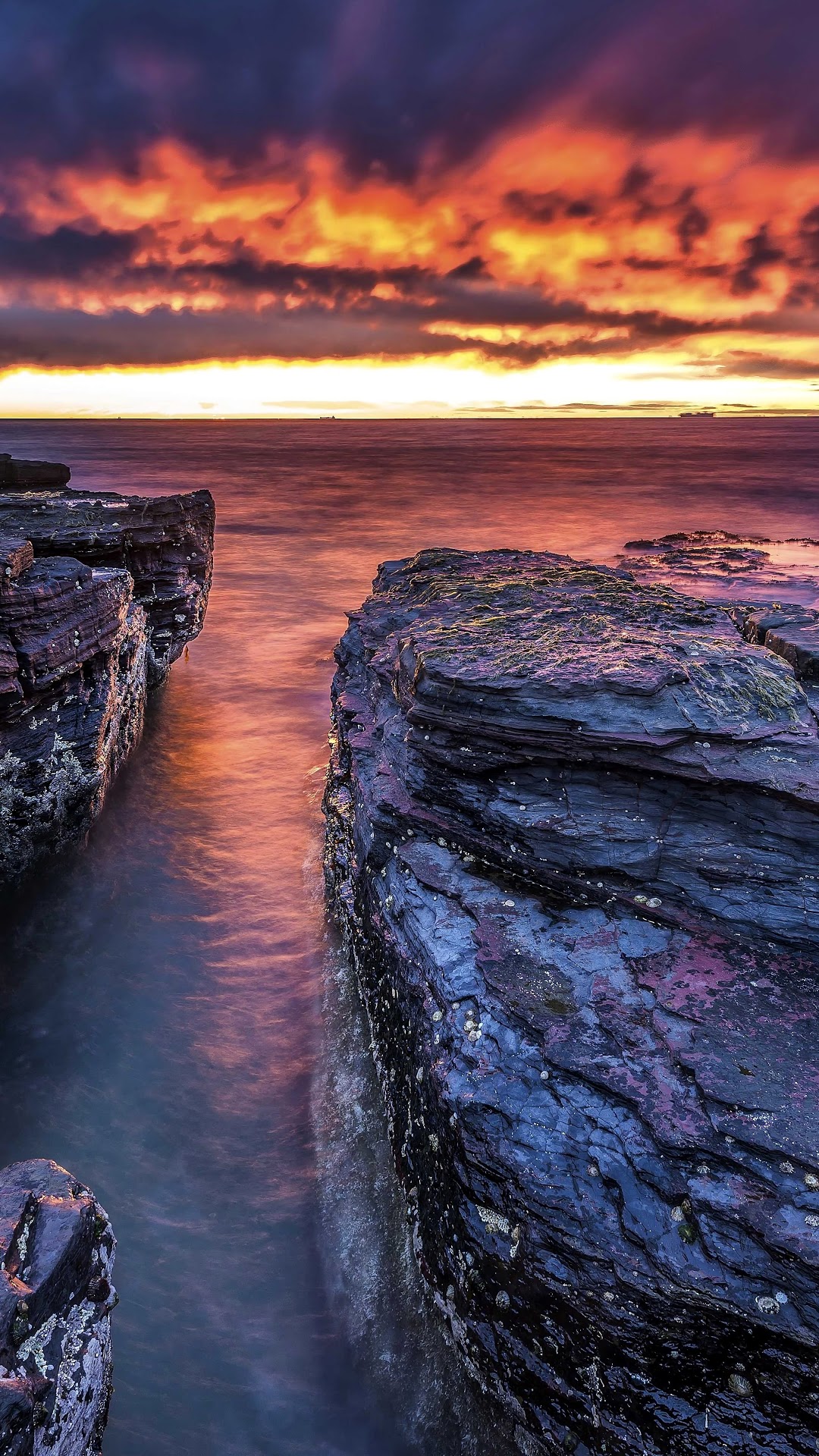 Seascape at Sunrise with Rocky Shoreline HD Phone Wallpaper