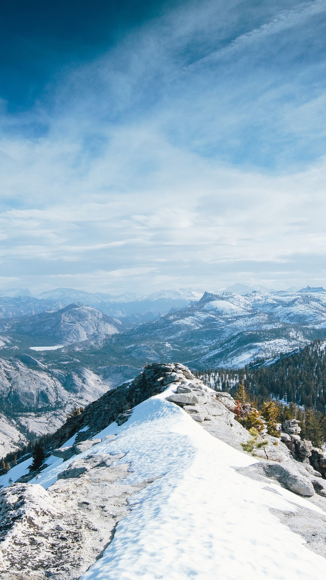 Snow-covered mountain range with a clear blue sky HD Phone Wallpaper