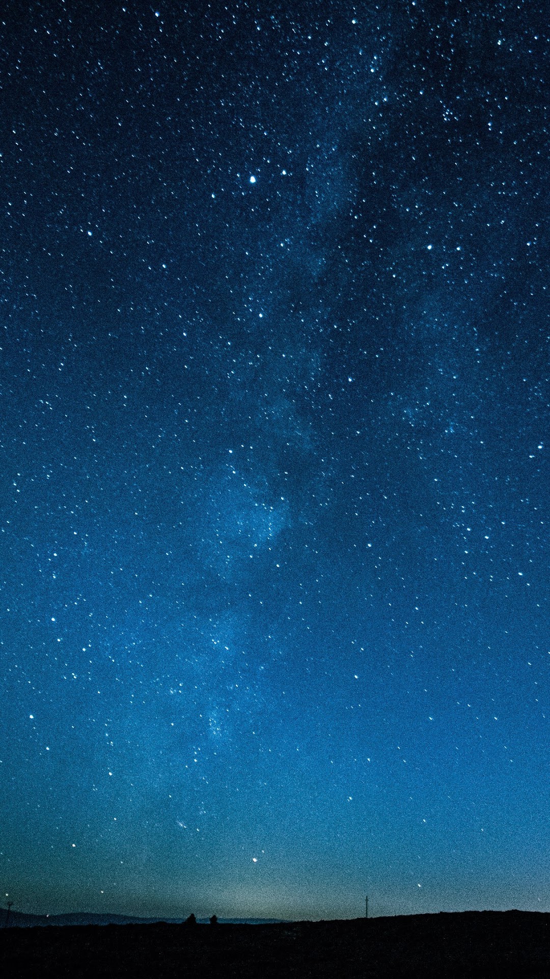 Night sky with stars and the Milky Way over a dark horizon HD Phone Wallpaper
