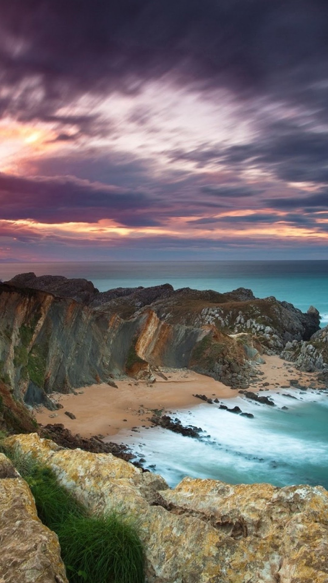 Dramatic Seascape at Sunrise with Rocky Cliffs and Beach HD Phone Wallpaper