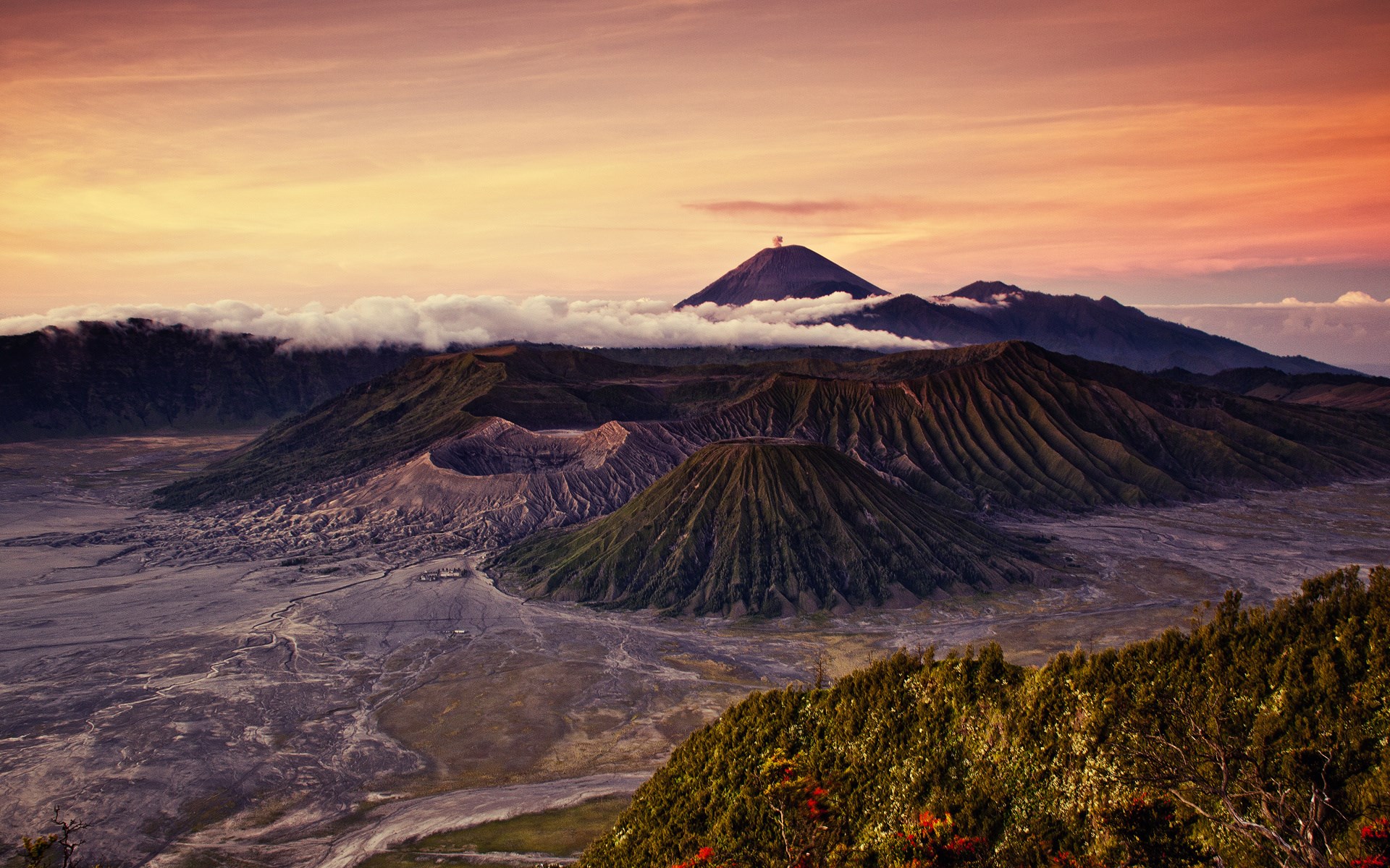 Volcanoes at sunrise with clouds and orange sky HD Wallpaper