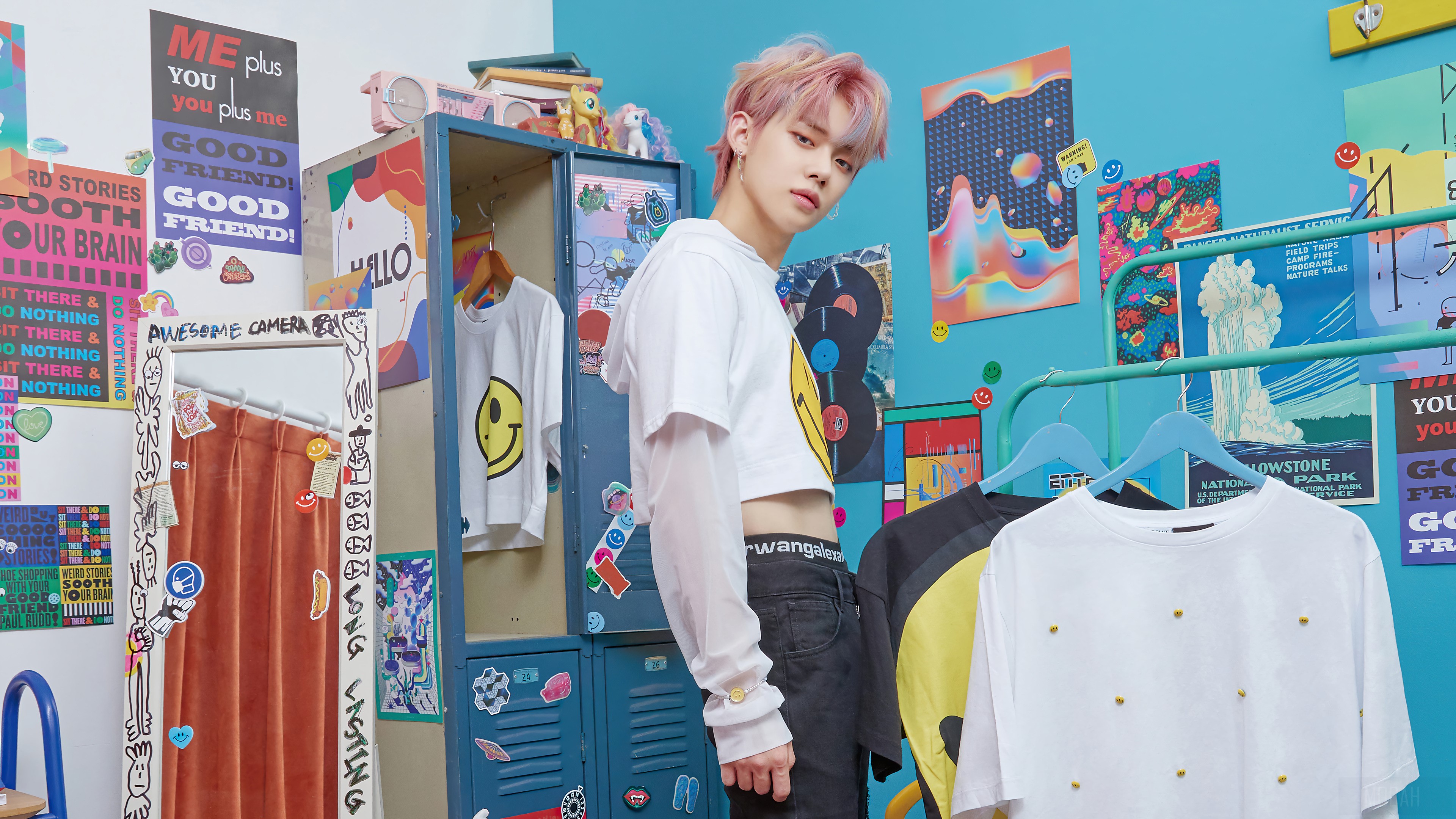 Yeonjun from TXT in a colorful room with clothes HD Wallpaper
