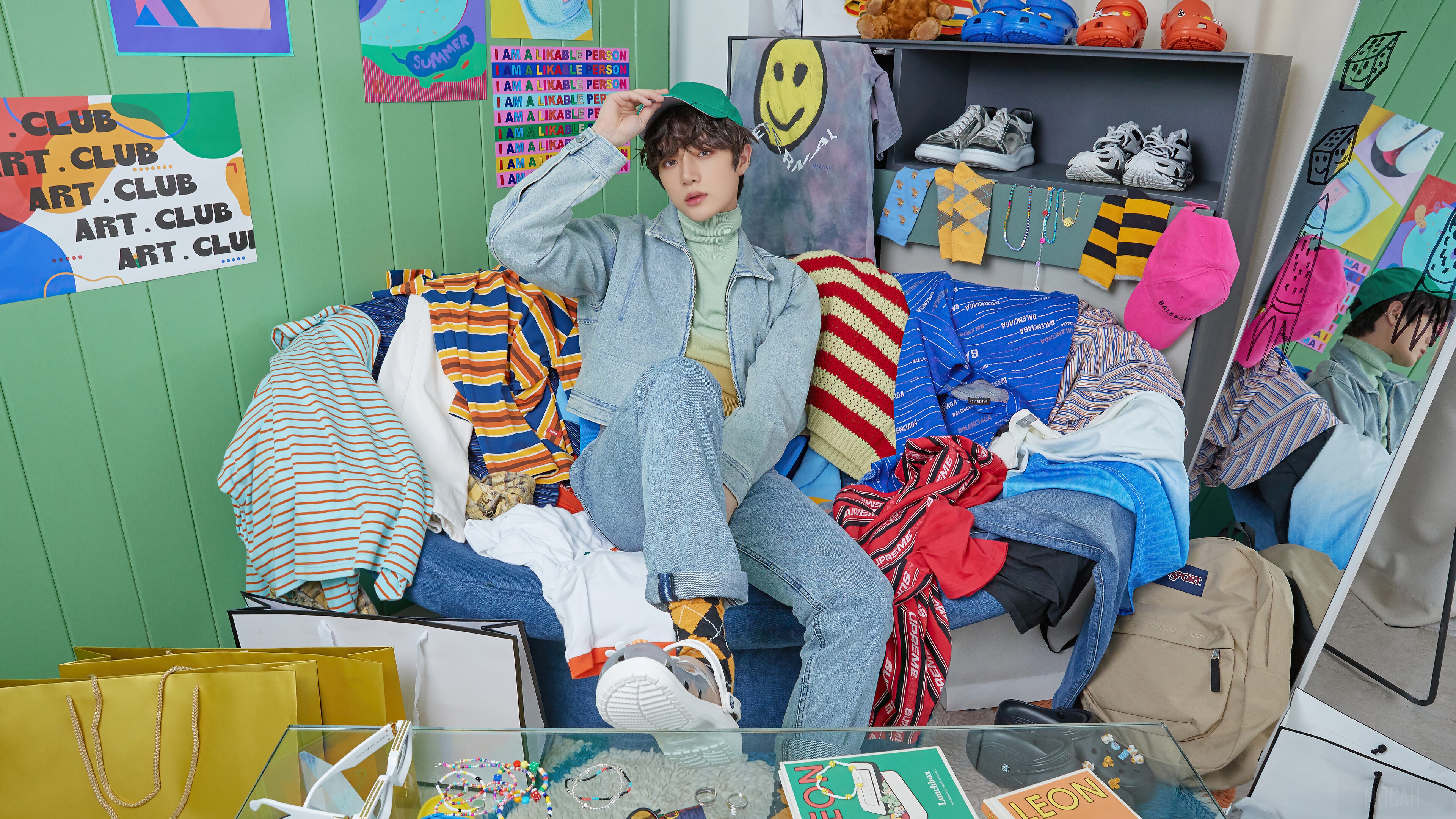 Beomgyu from TXT in a room full of clothes HD Wallpaper