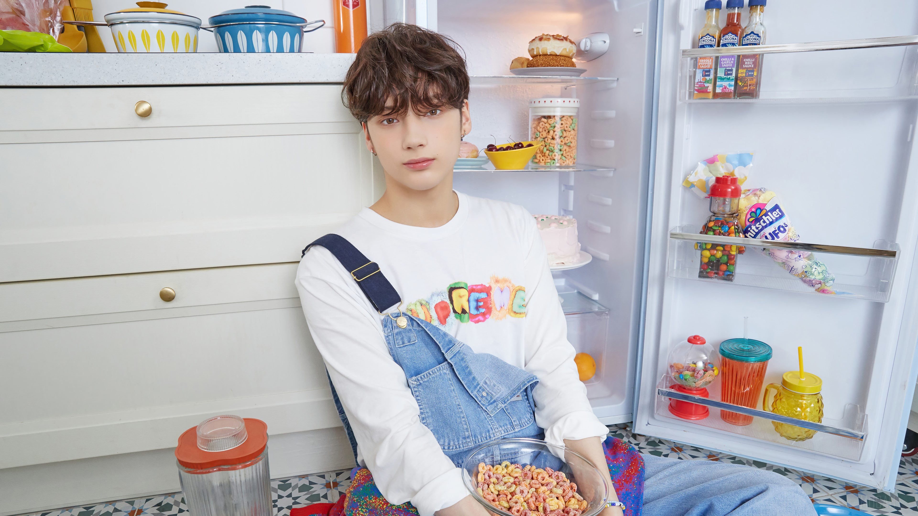 Huening Kai from TXT in a kitchen with a refrigerator HD Wallpaper