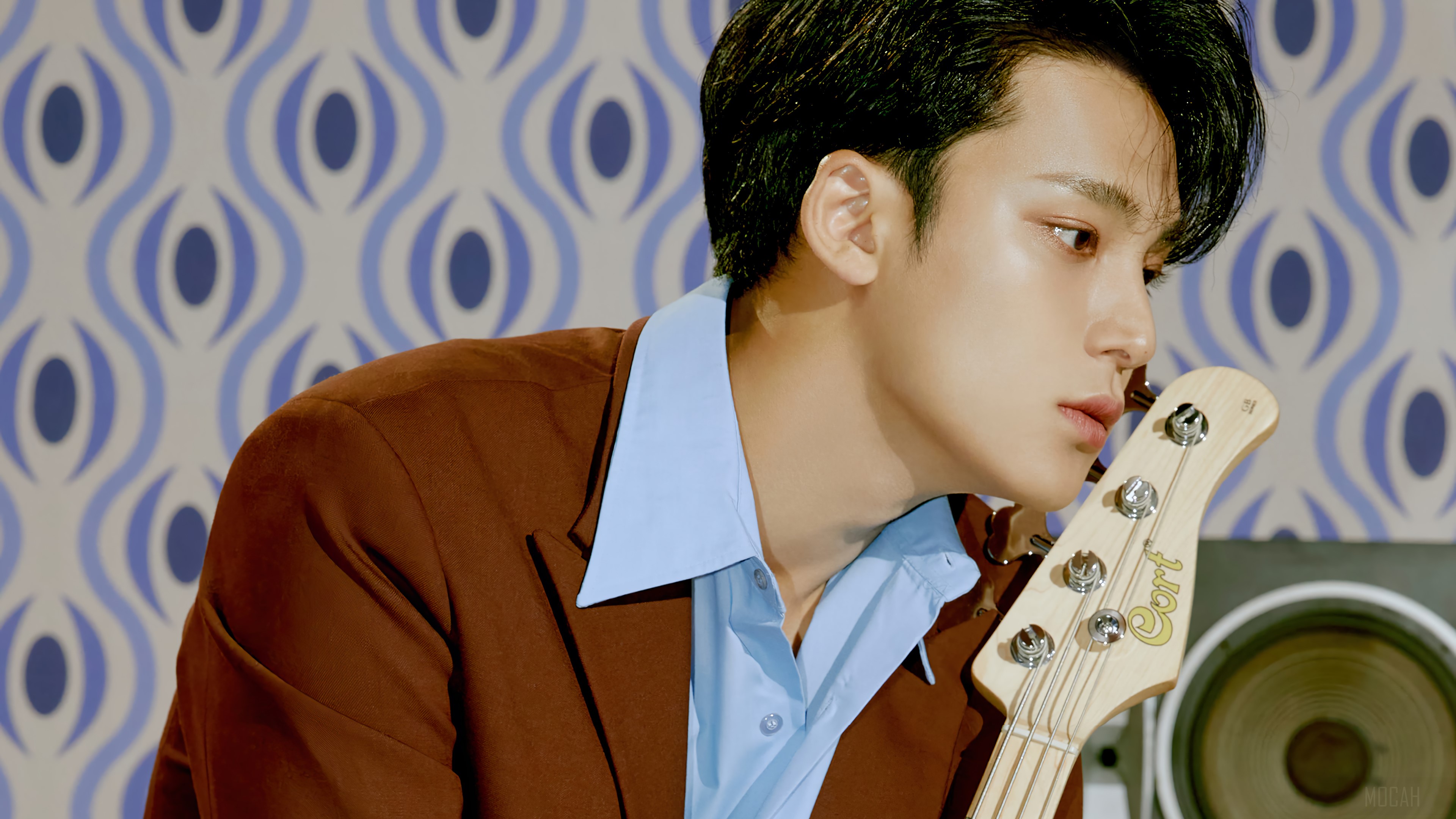 Kim Mingyu from Seventeen holding a Cort bass guitar HD Wallpaper