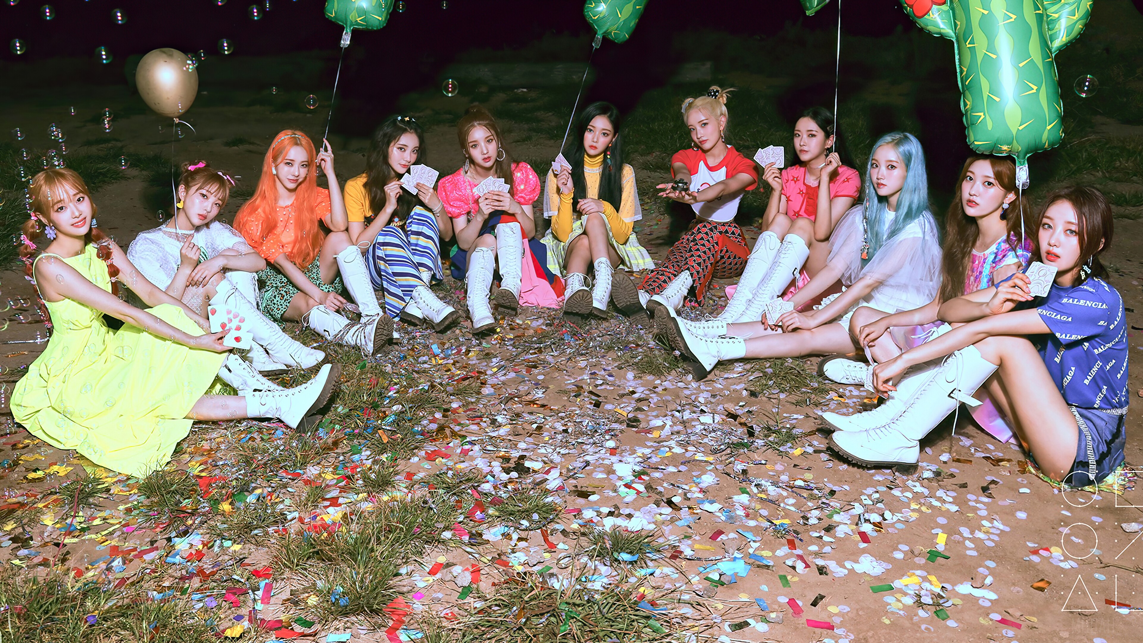 LOONA members sitting on the ground with balloons and confetti HD Wallpaper