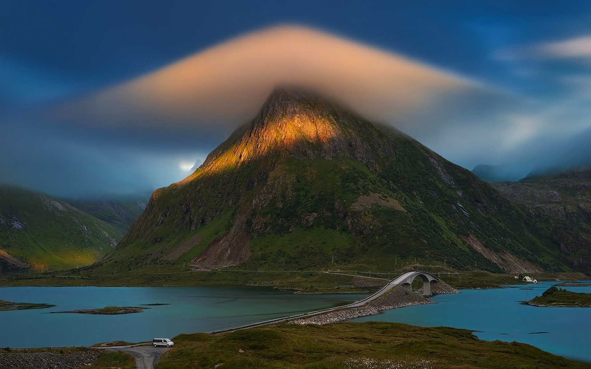 Mountain with lenticular cloud over a bridge and lake HD Wallpaper
