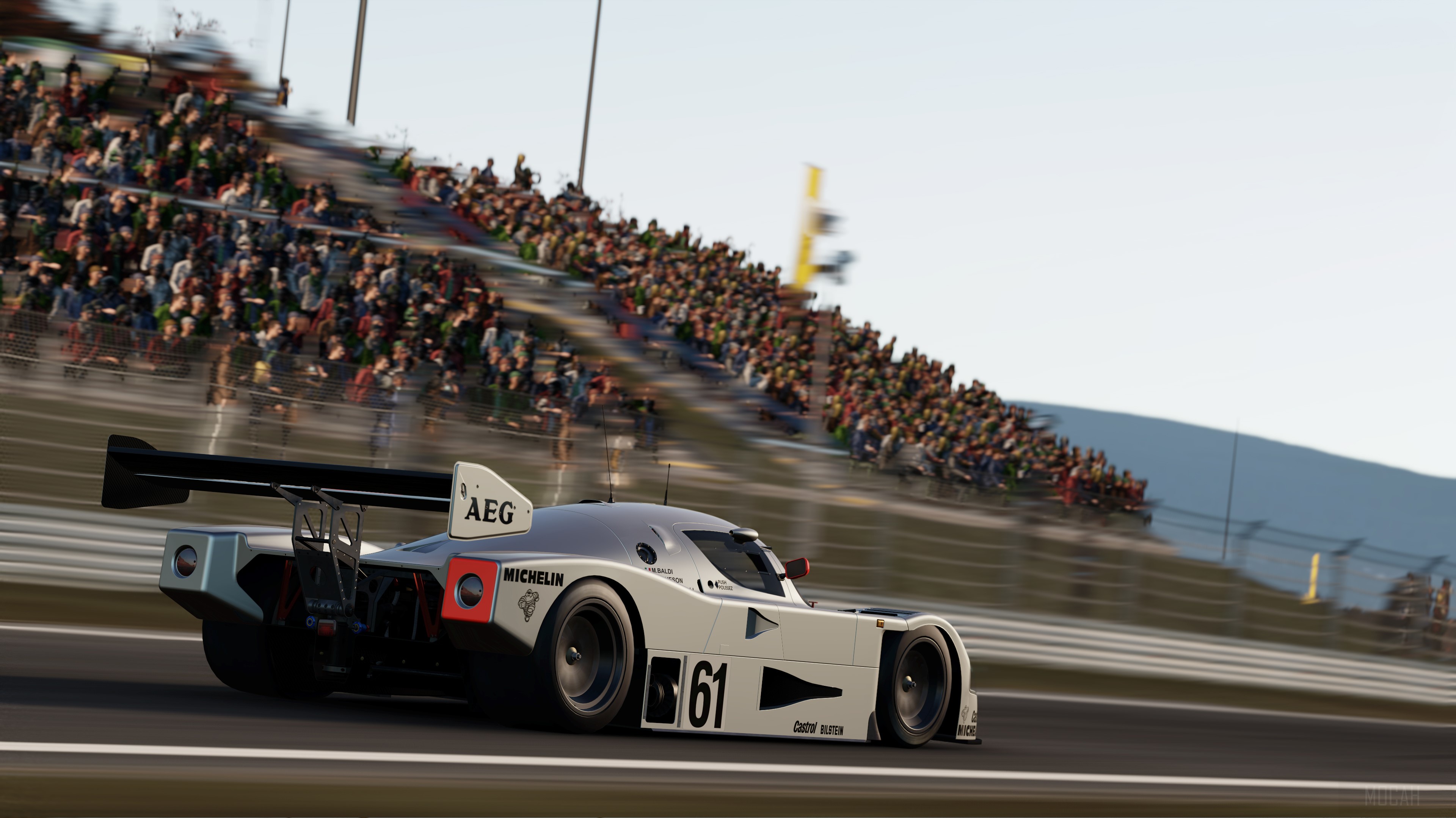 Racing car with number 61 on a race track HD Wallpaper