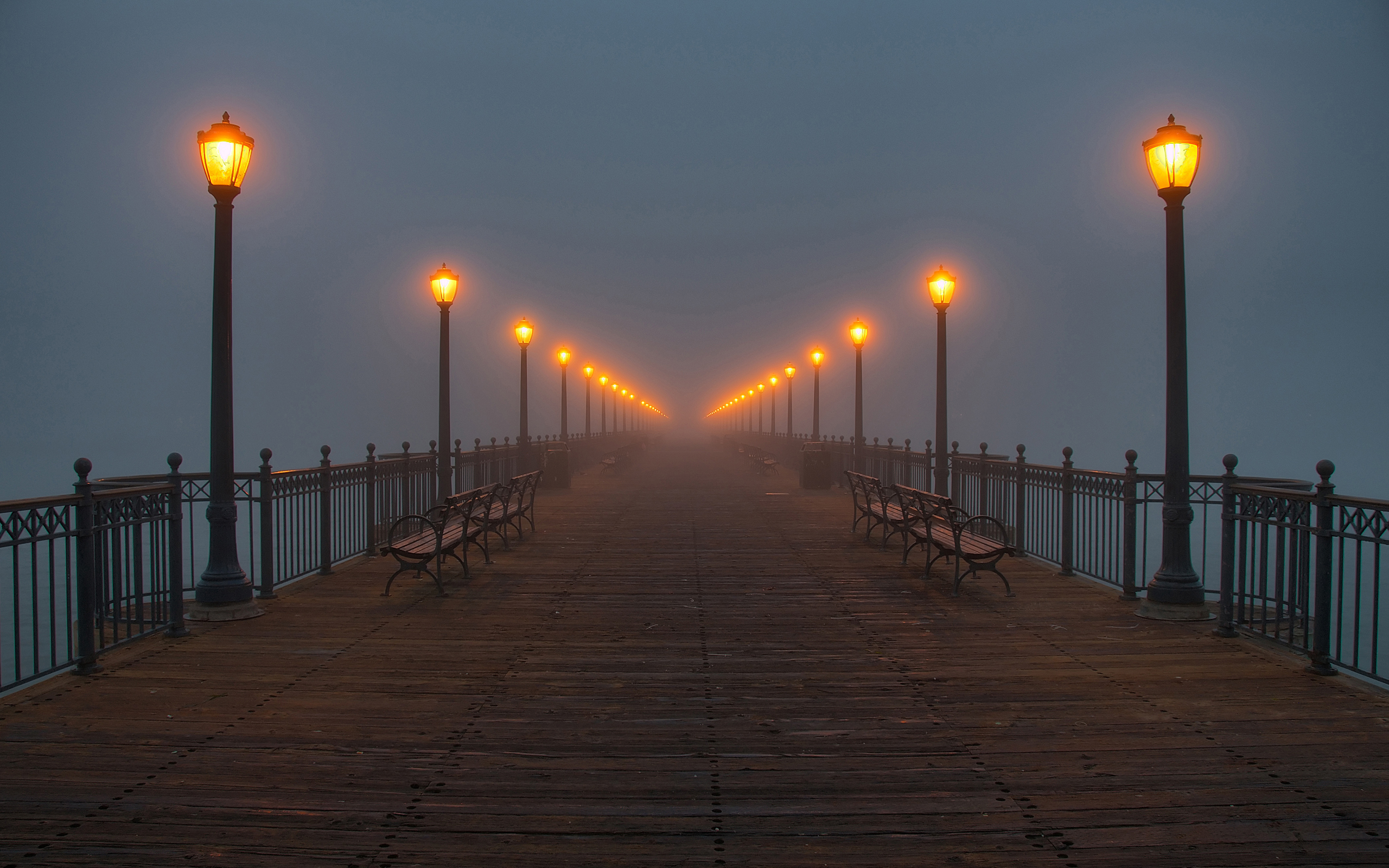 Foggy Pier with Illuminated Lamps at Dusk HD Wallpaper