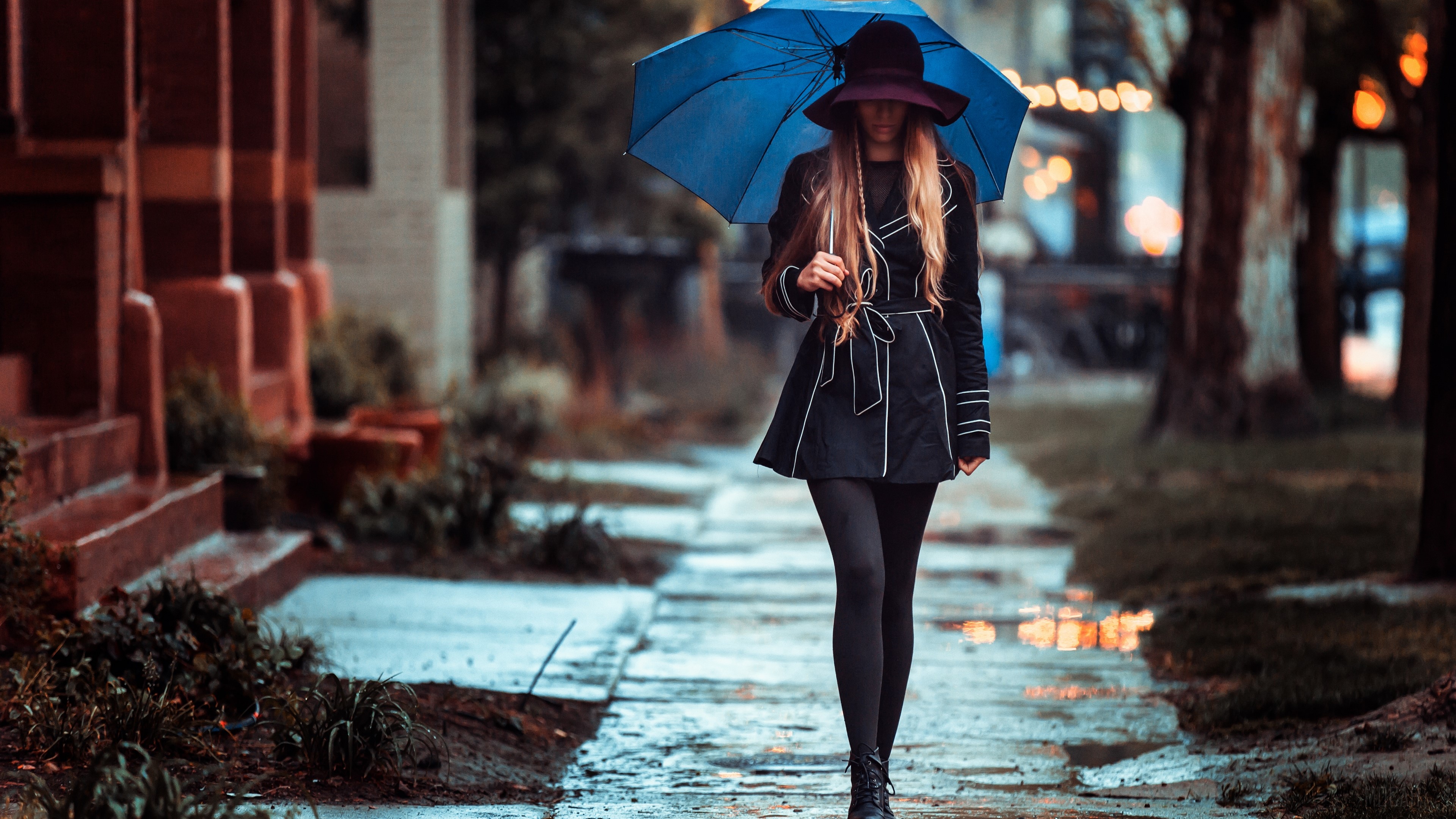 Woman with umbrella walking on wet sidewalk HD Wallpaper
