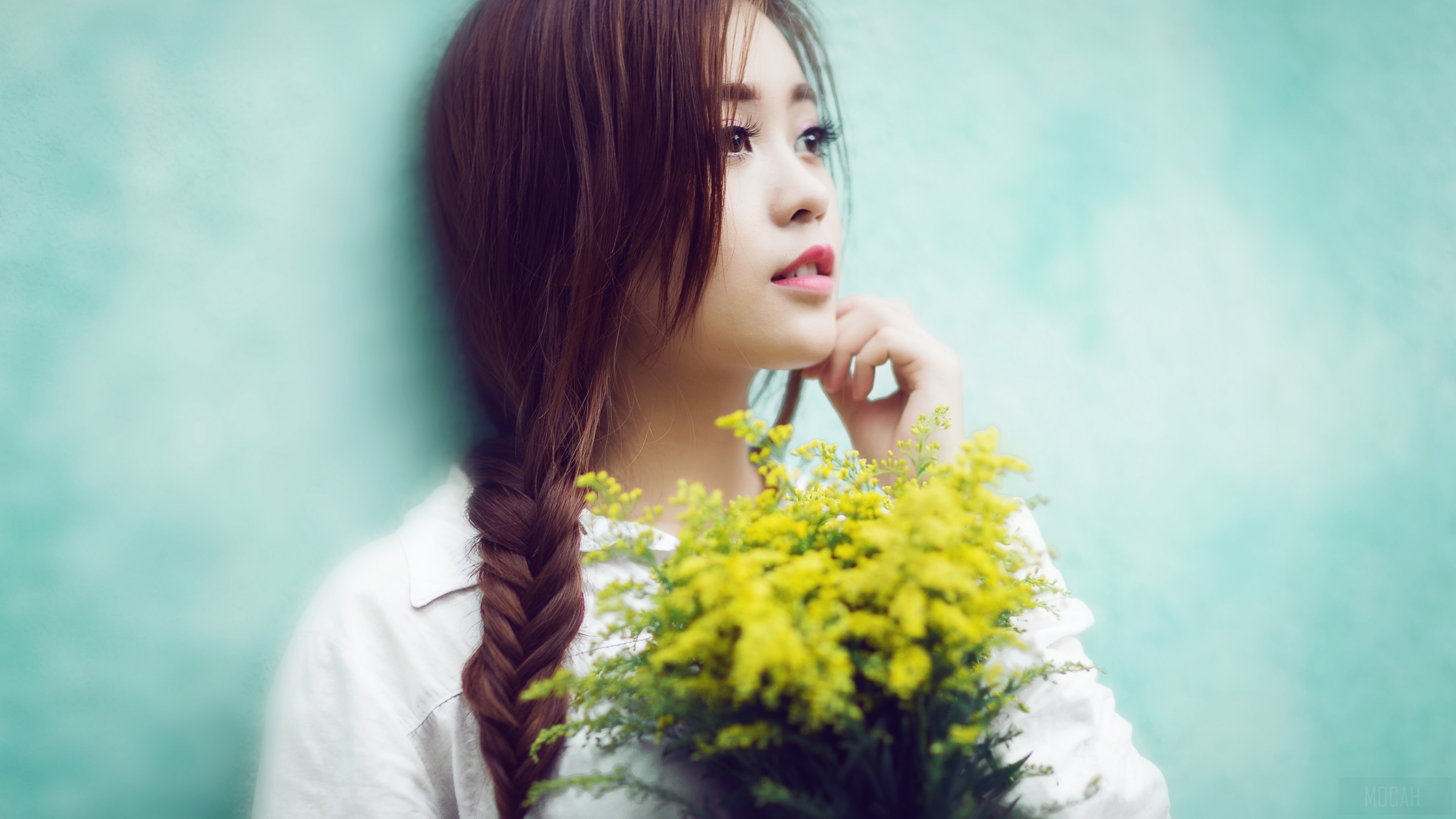 Young woman with braided hair holding yellow flowers HD Wallpaper