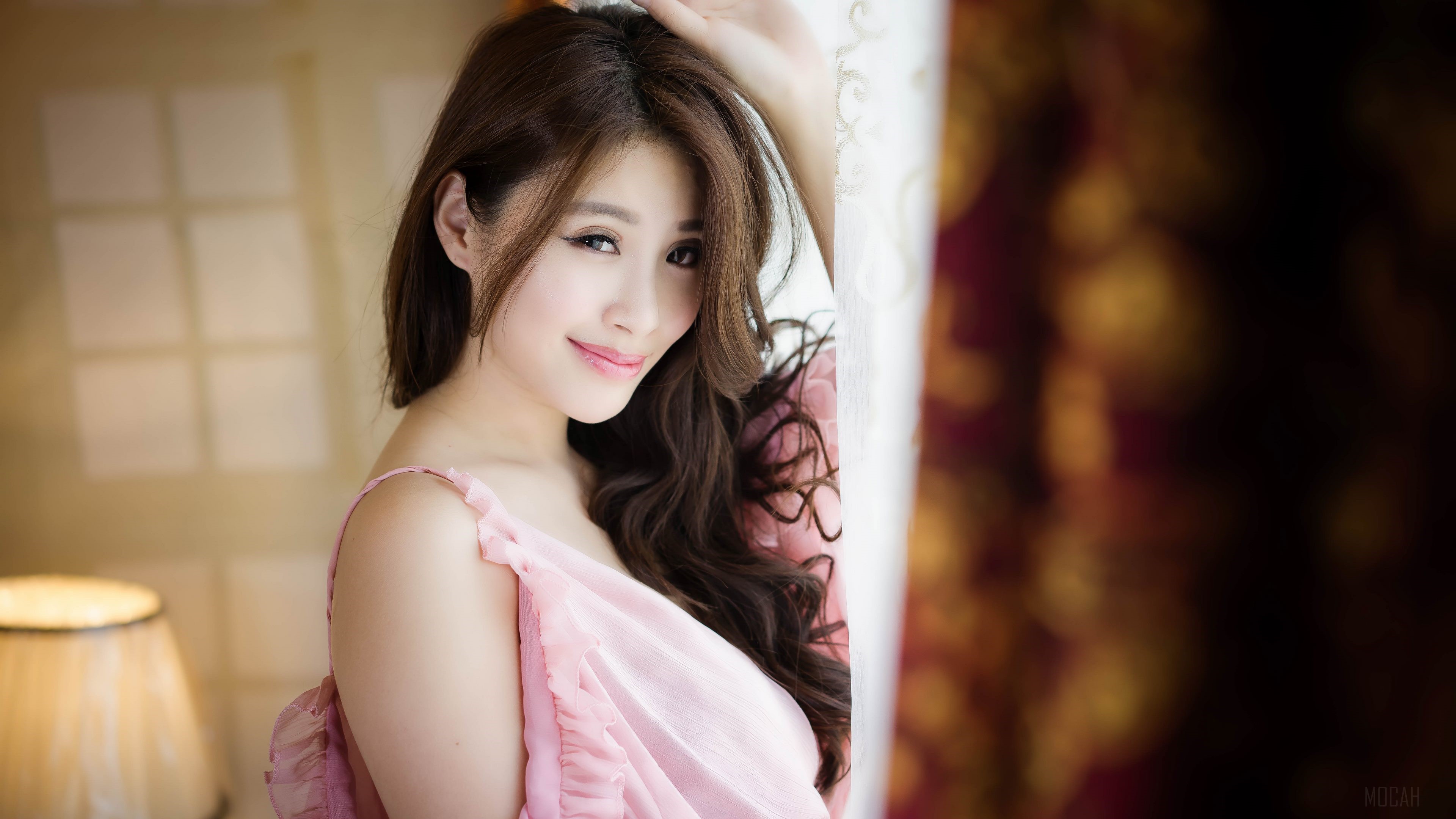 Smiling Woman in Soft Pink Dress 4K HD Wallpaper