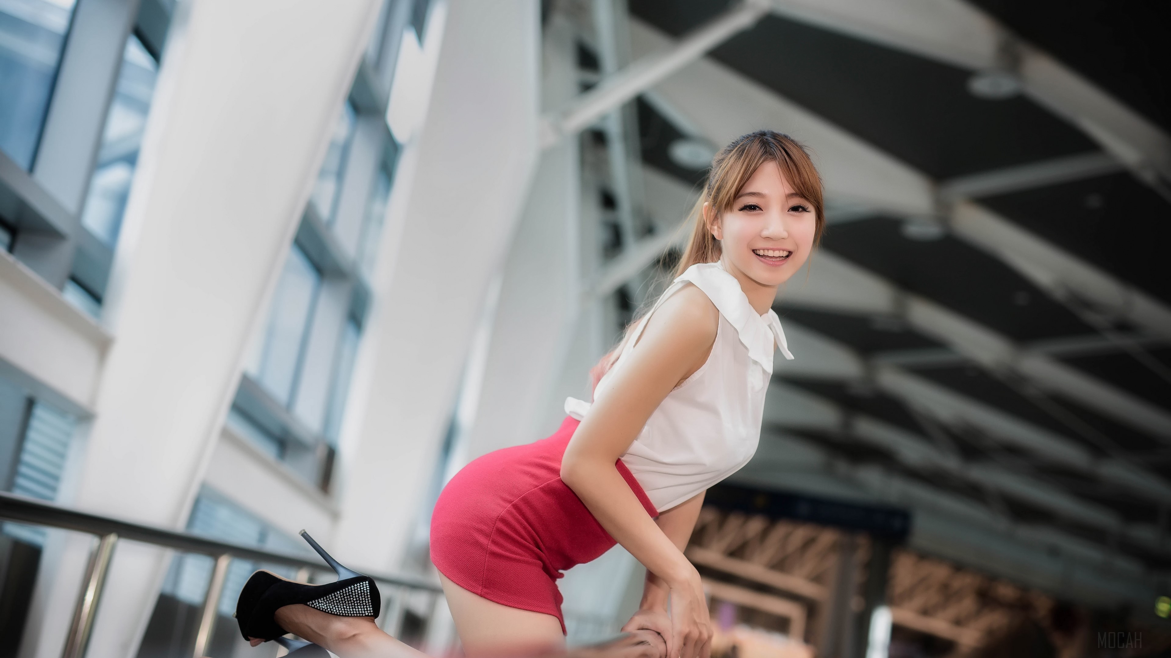 Woman in white top and red skirt posing HD Wallpaper