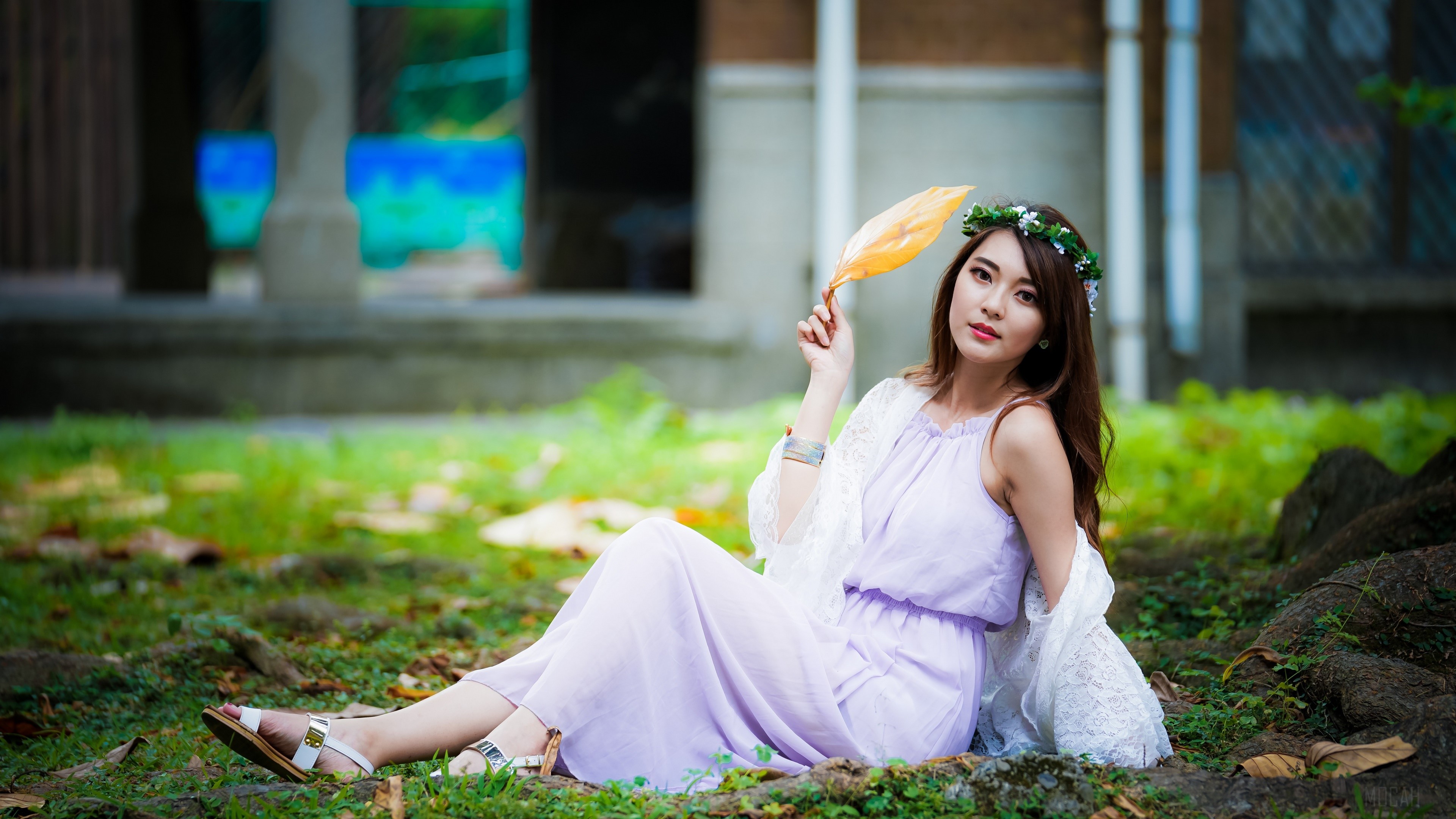 Asian woman with flower wreath holding a leaf HD Wallpaper