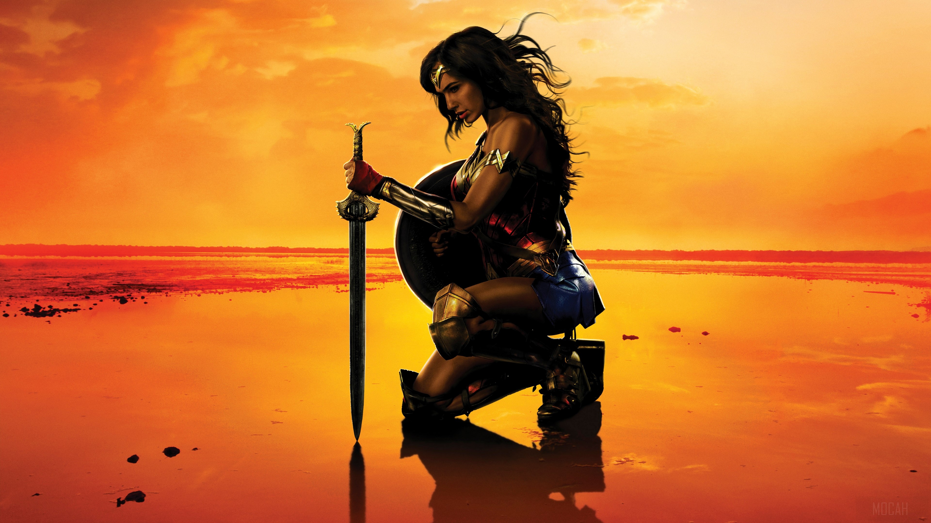 Wonder Woman from DC Comics kneeling with sword and shield HD Wallpaper