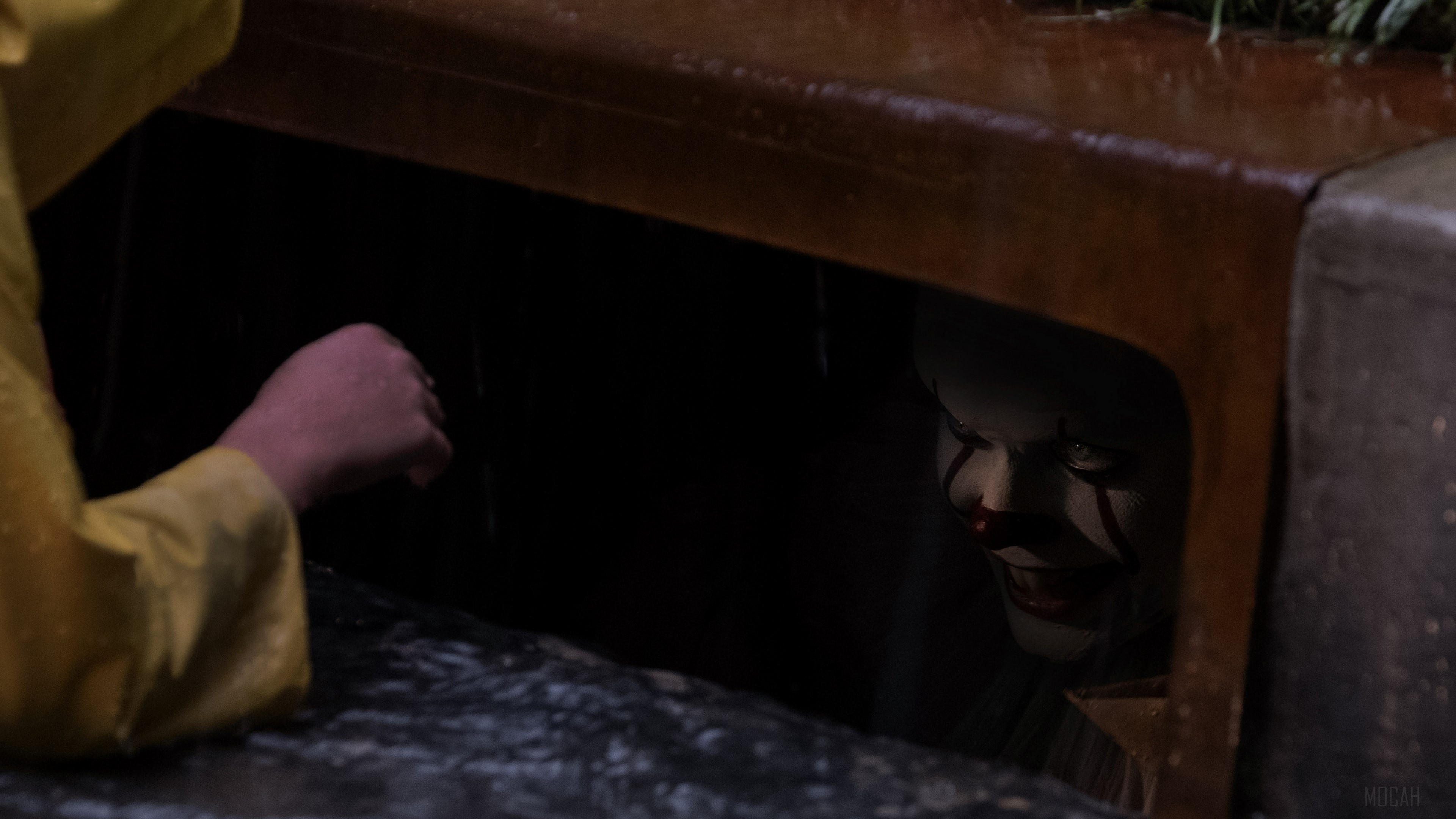Pennywise the Clown in Rainy Sewer Scene 4K HD Wallpaper