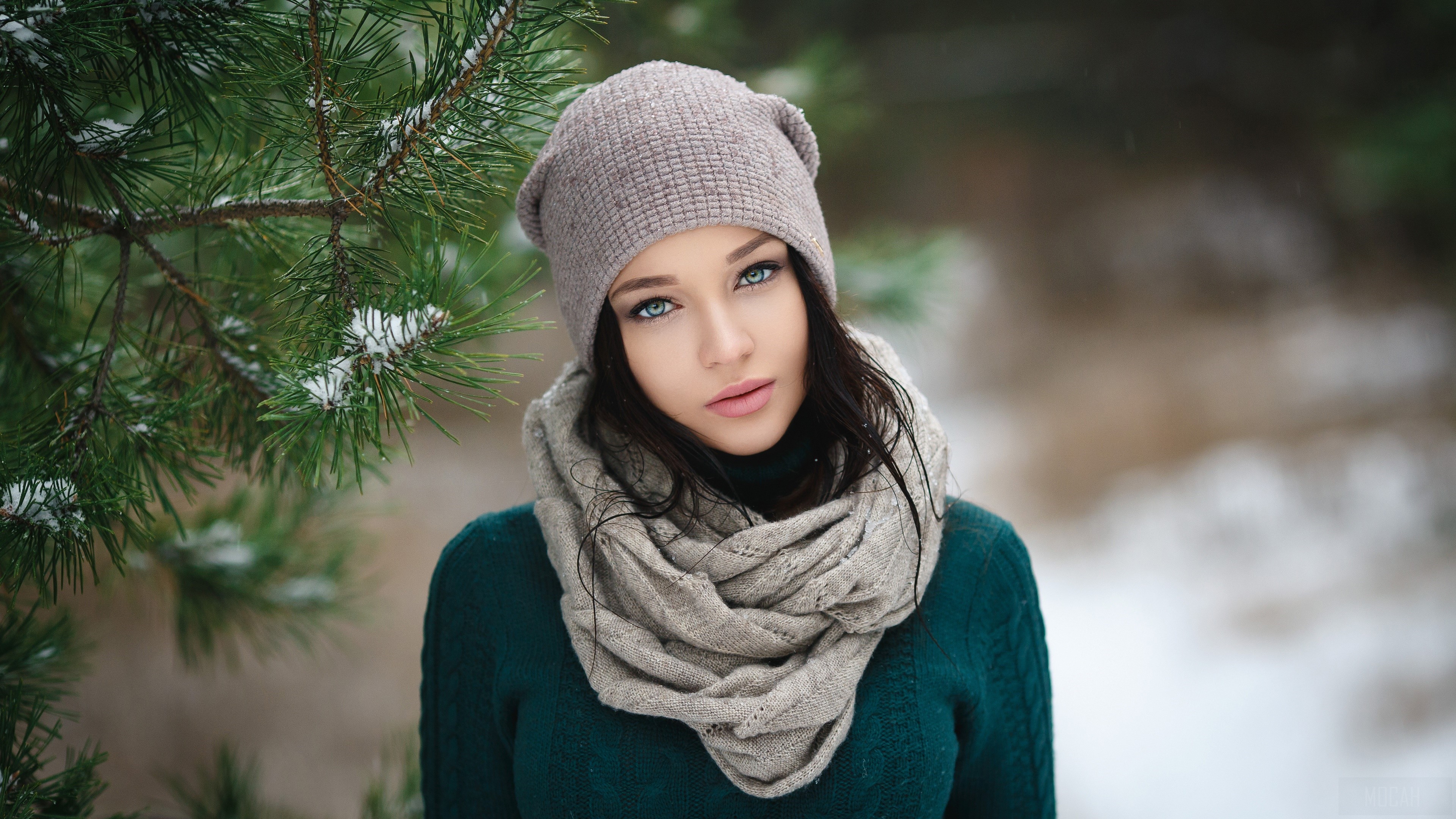 Woman with blue eyes wearing a hat and scarf in winter HD Wallpaper