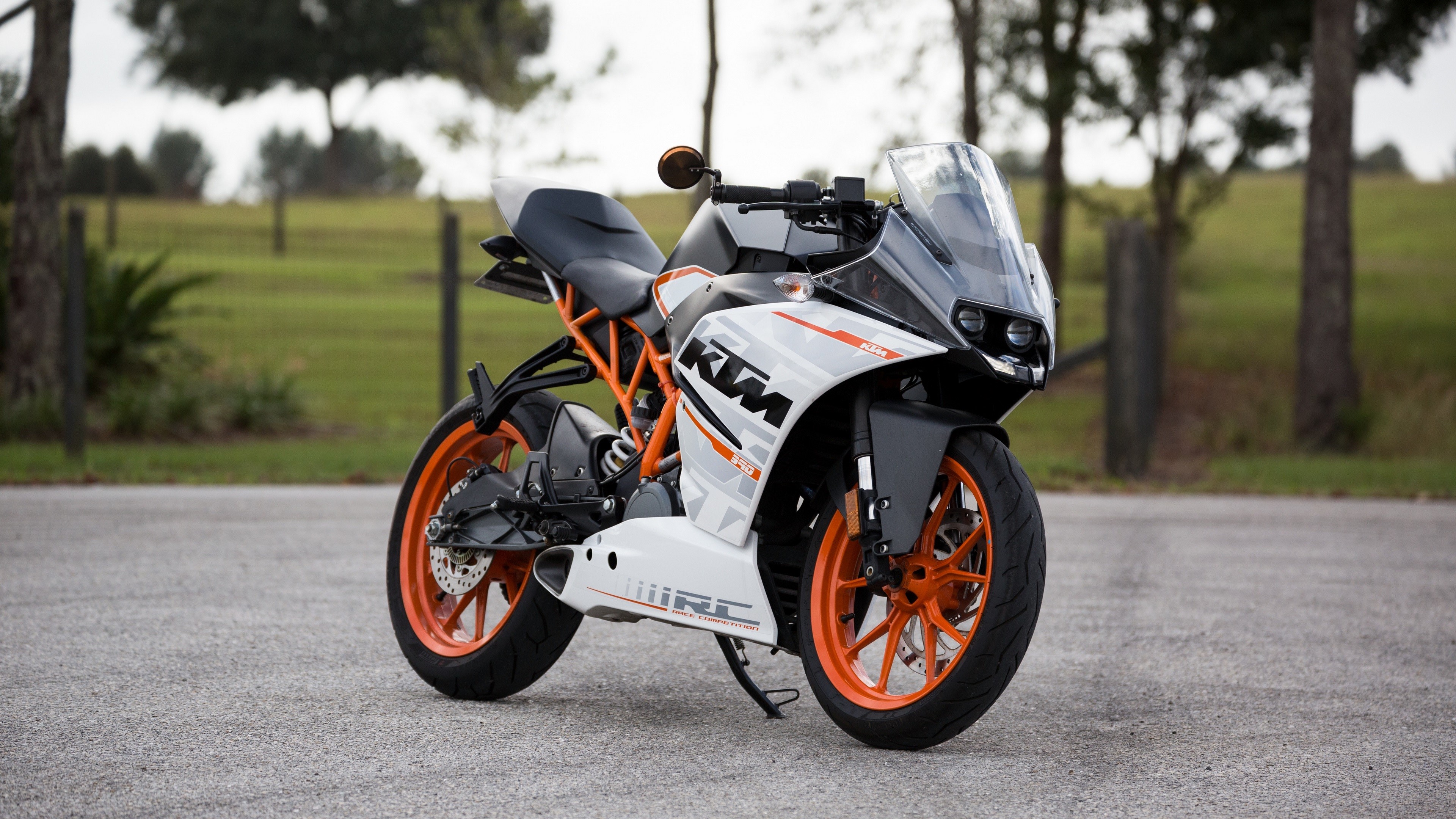 White and orange KTM RC 390 motorcycle 4K HD Wallpaper