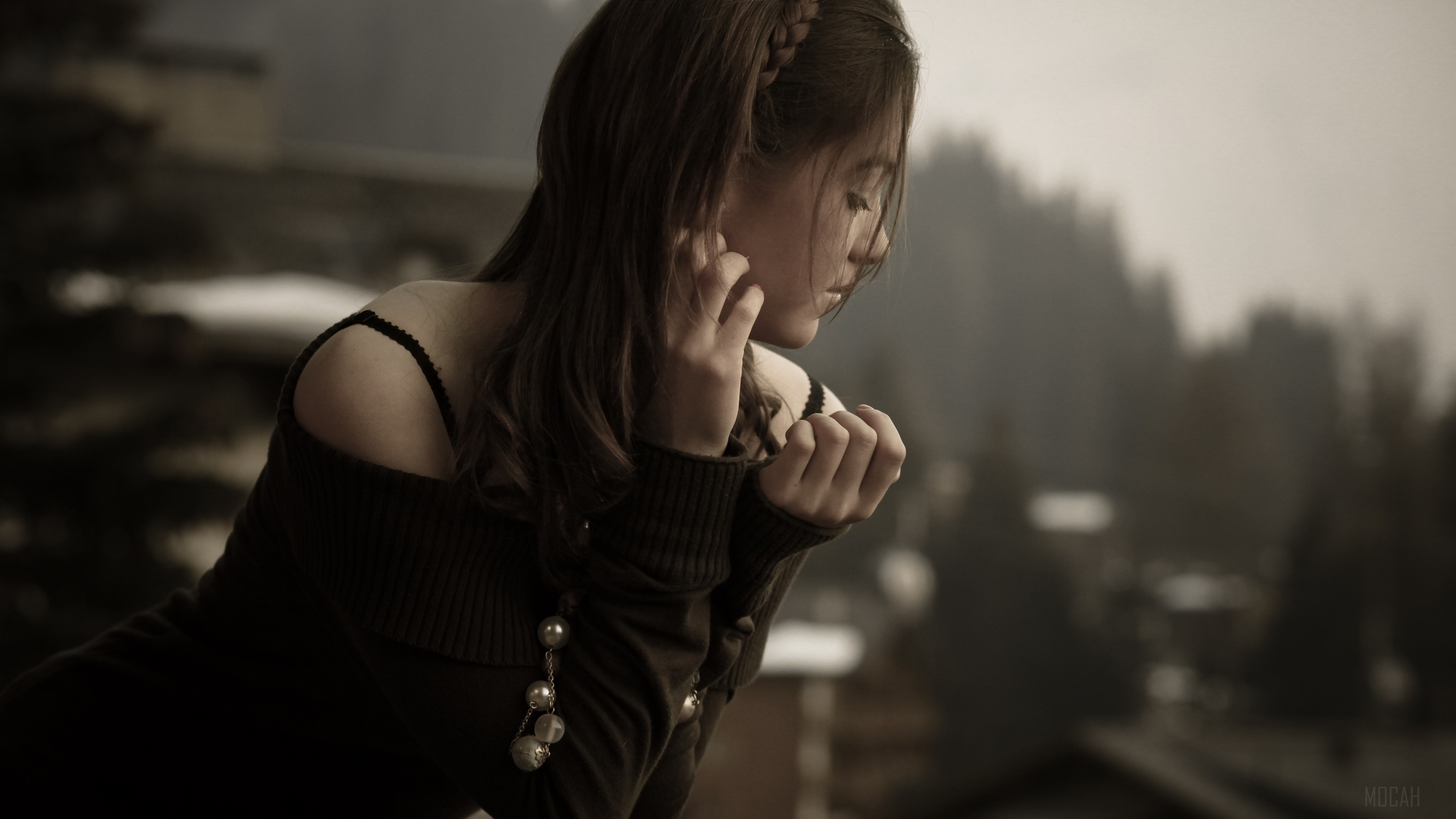 Woman with braided hair looking down HD Wallpaper