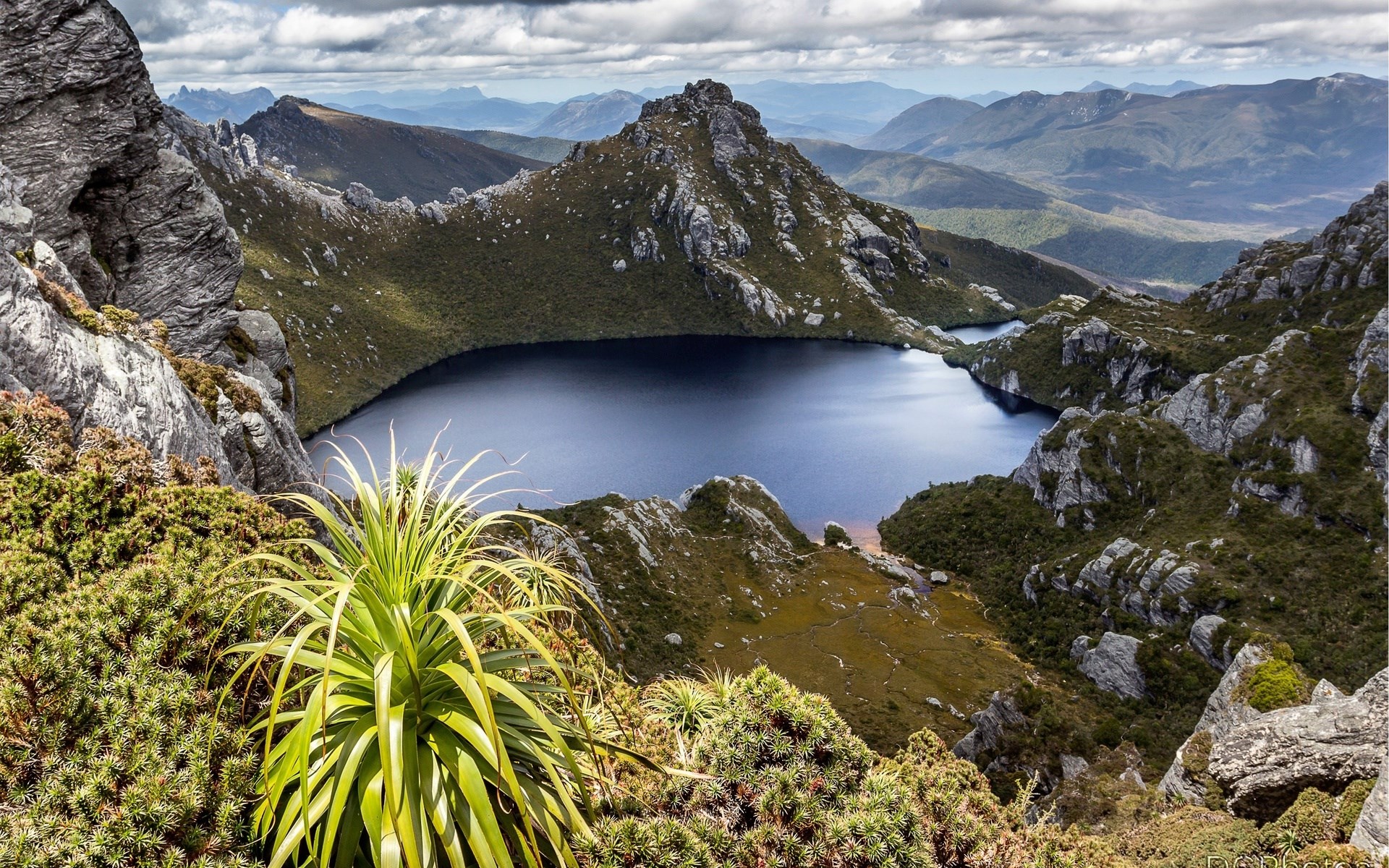 Lake surrounded by mountains and vegetation HD Wallpaper