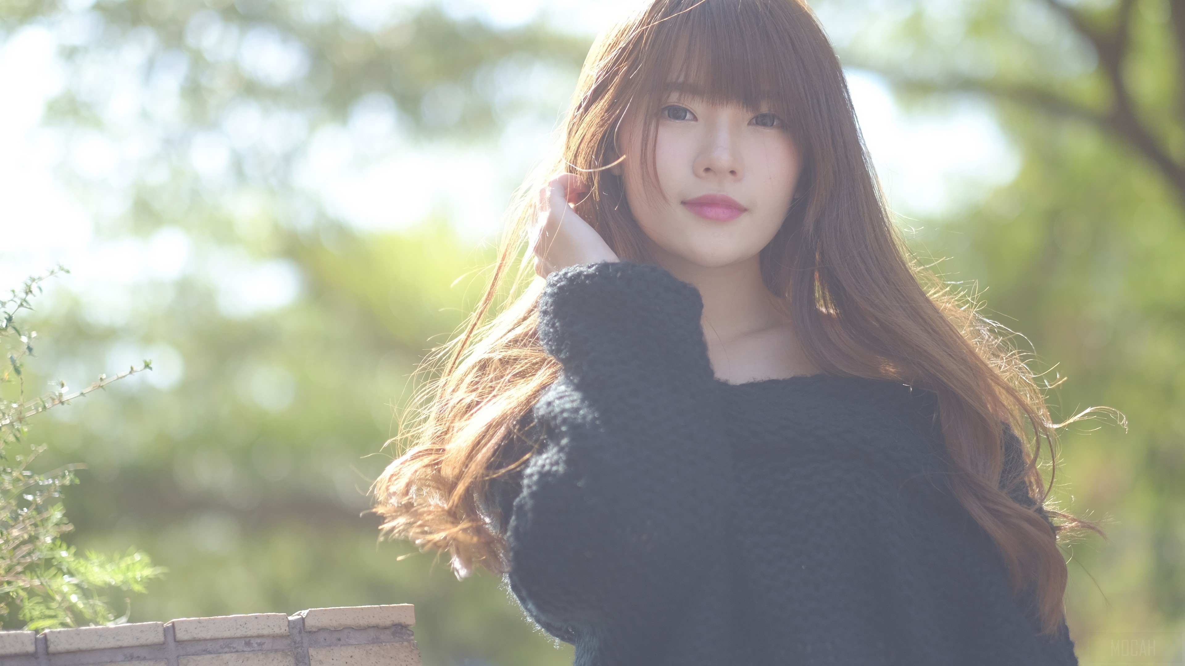 Young woman with long brown hair HD Wallpaper