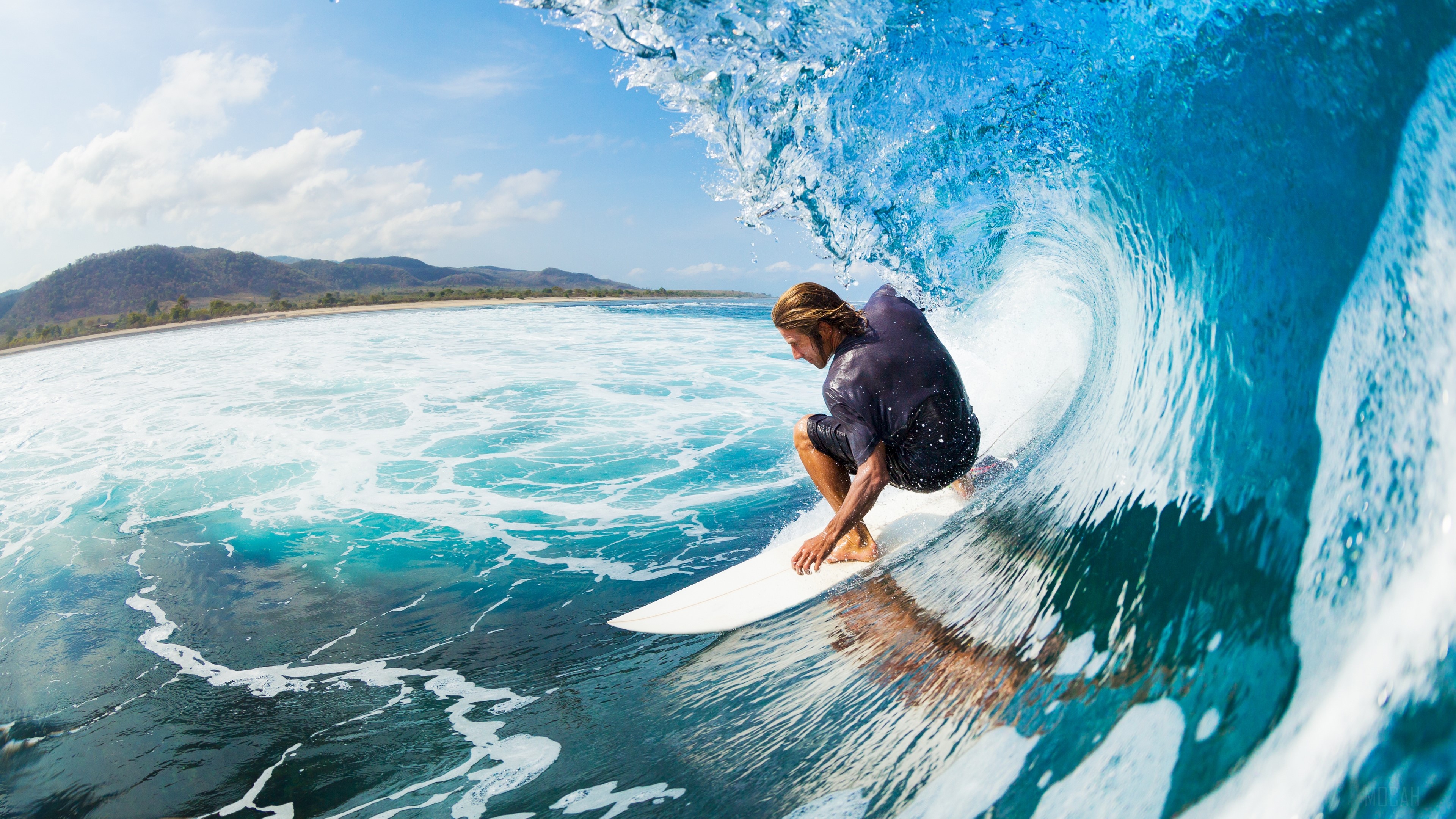 Surfer riding a wave in the ocean HD Wallpaper