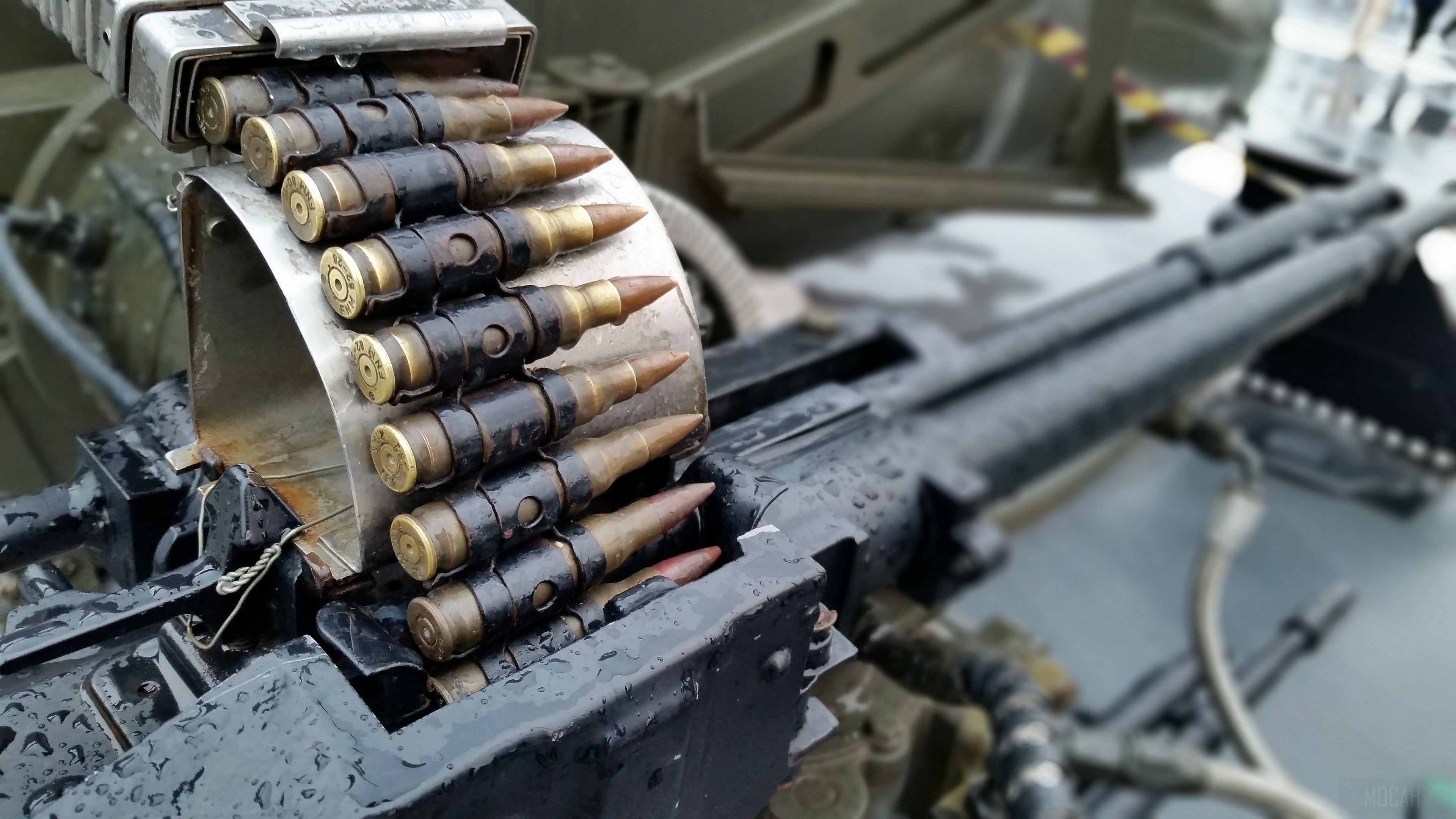Machine gun with ammunition belt 4K HD Wallpaper