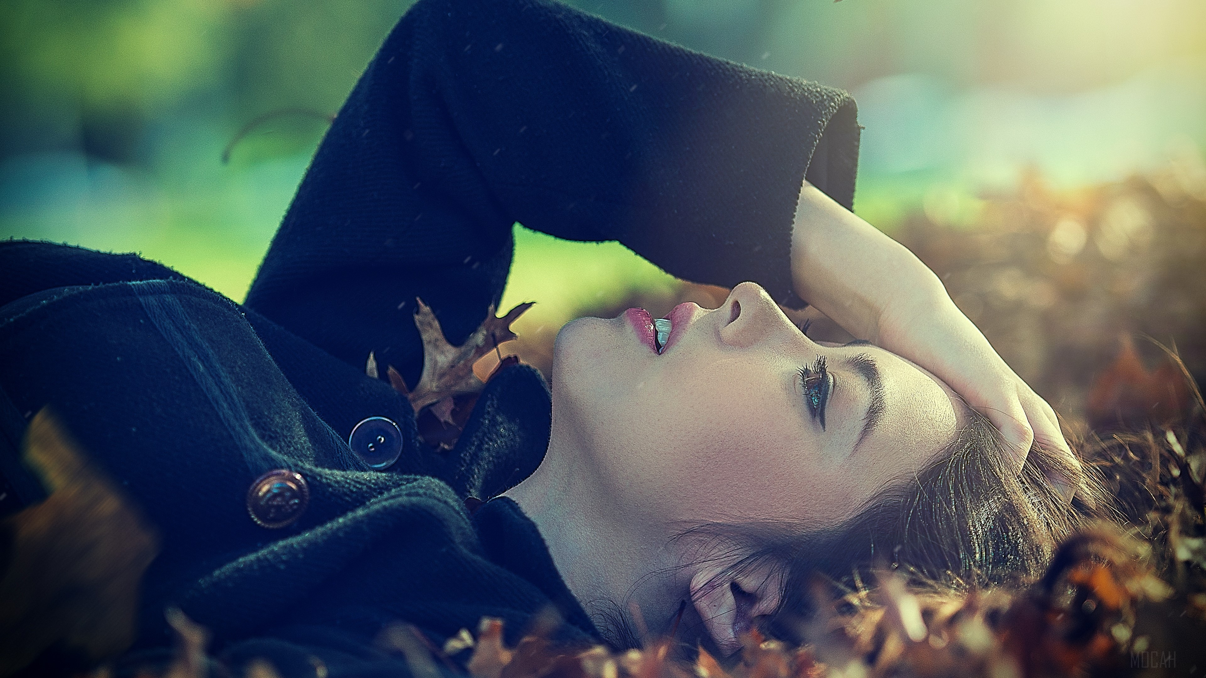 Woman Lying Down in Autumn Leaves 4K HD Wallpaper