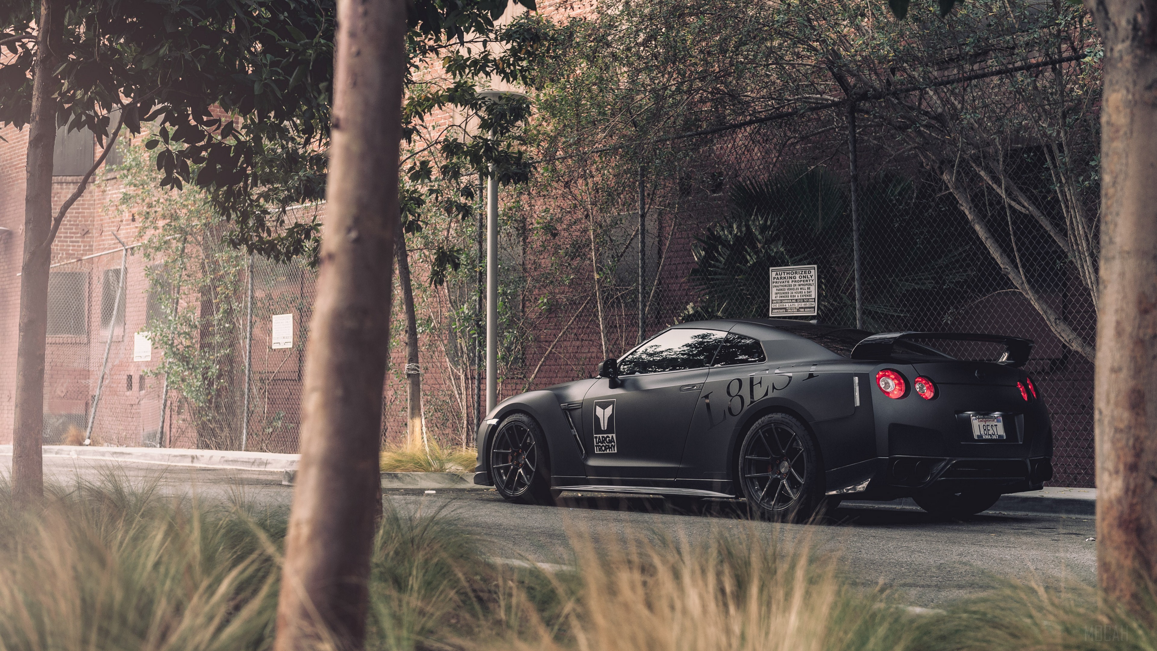 Black Nissan GT-R with custom decals HD Wallpaper