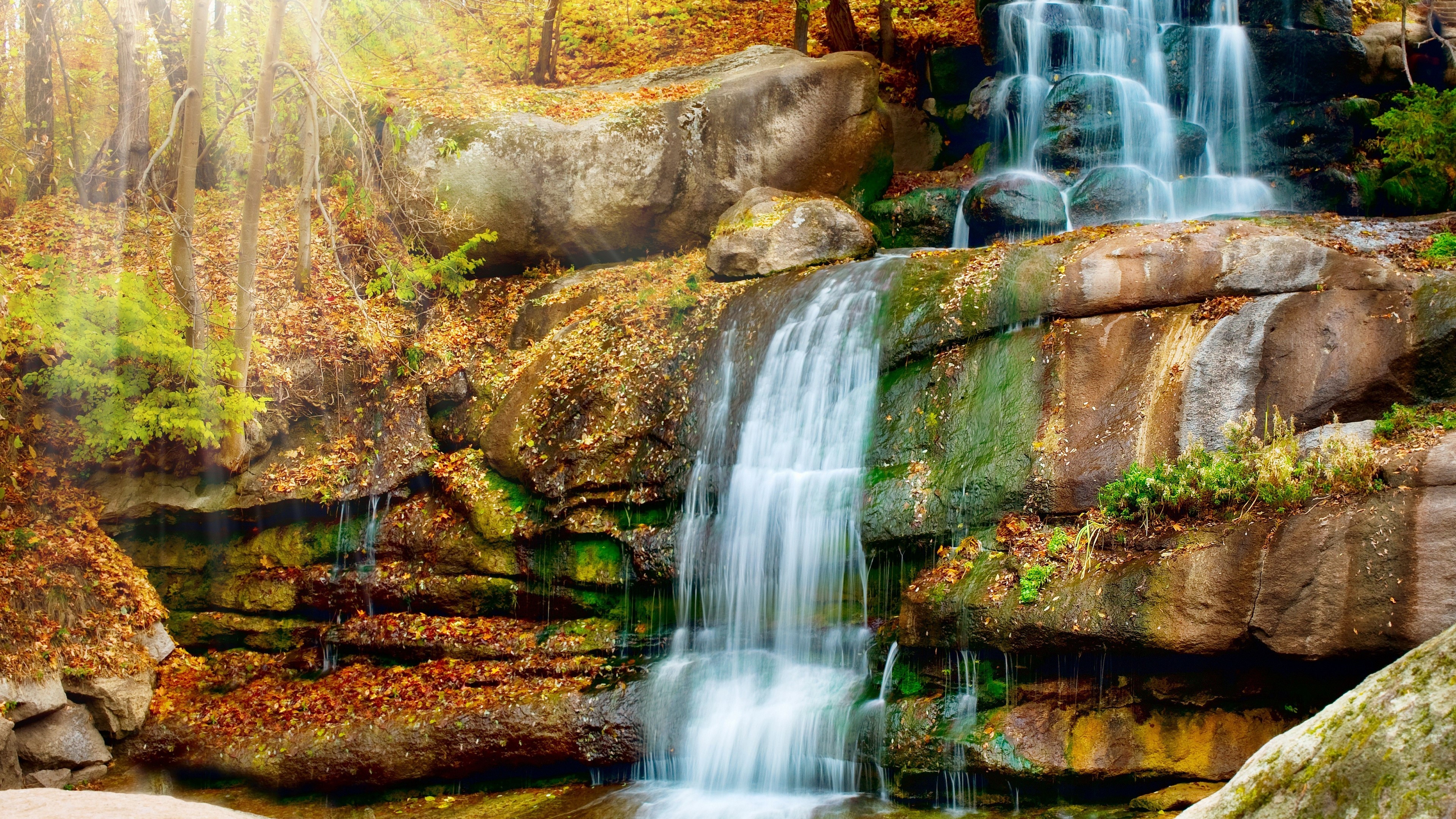 Waterfall with Autumn Leaves and Sunbeams 4K HD Wallpaper