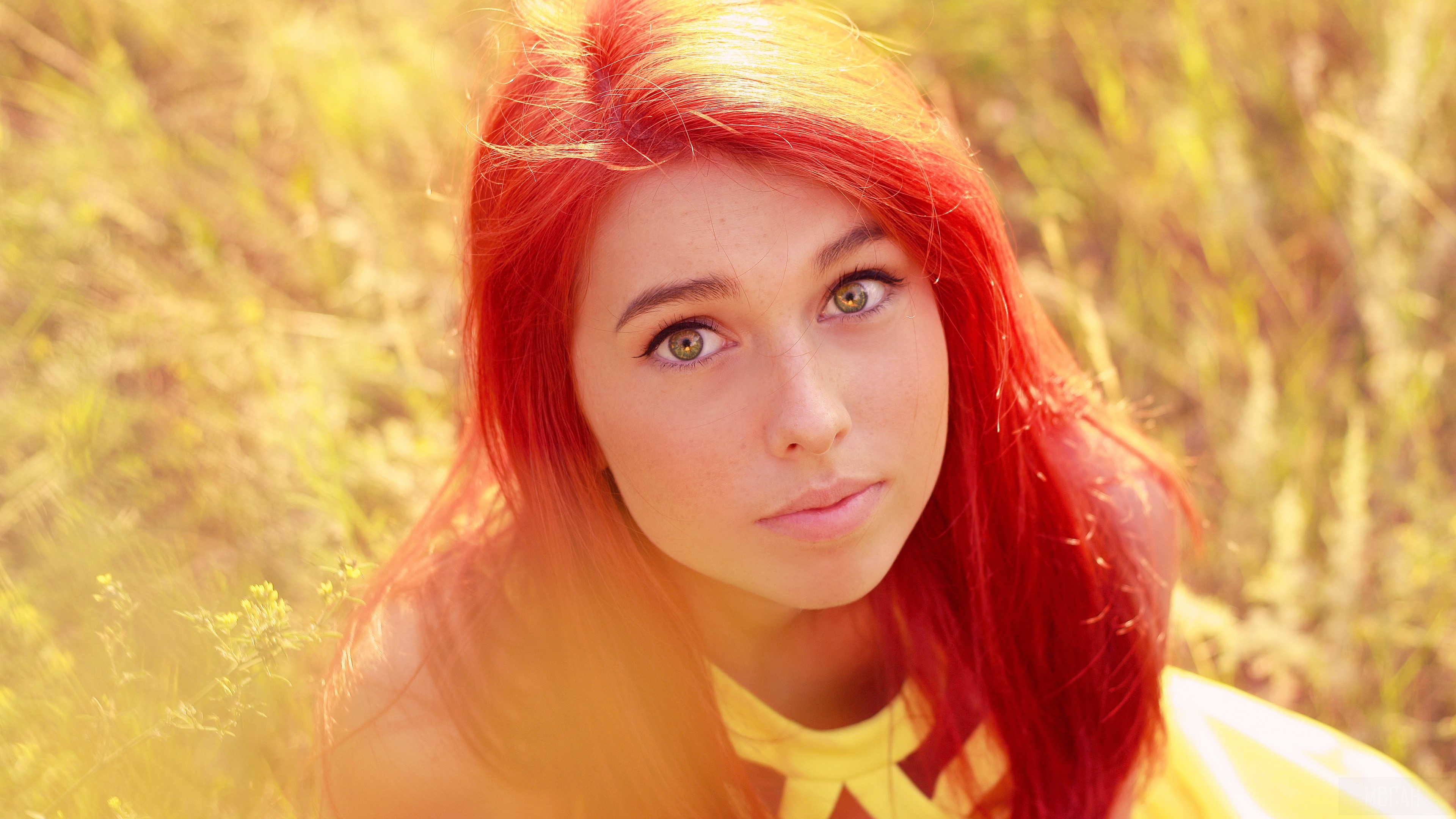 Young woman with red hair in a field HD Wallpaper