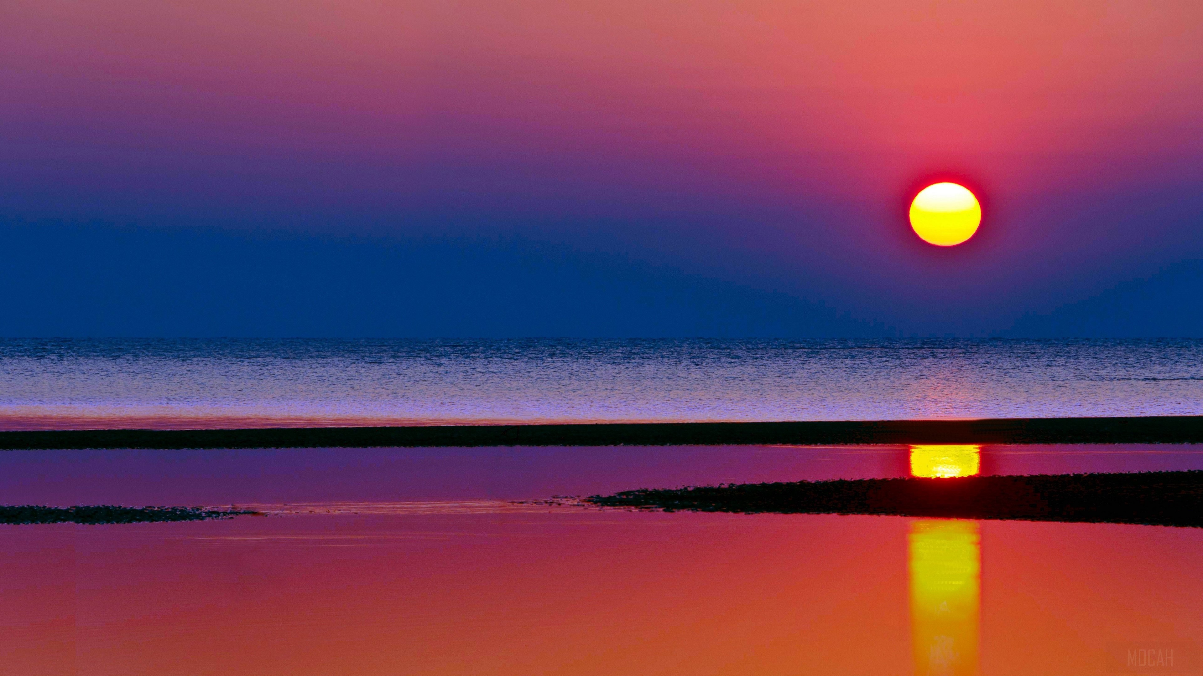 Sunset over the sea with reflection HD Wallpaper