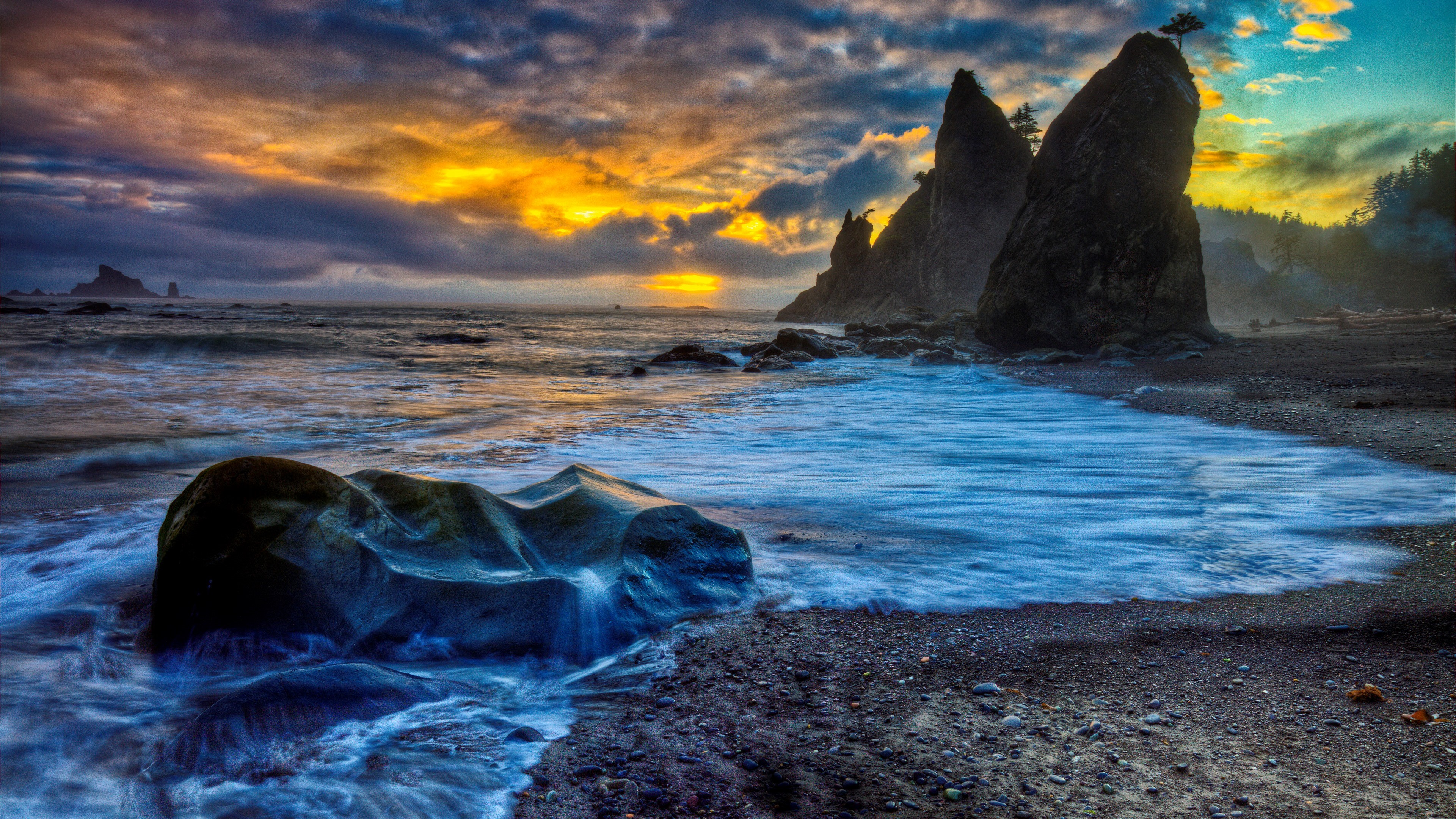 Sunset Over Rocky Seashore with Vibrant Evening Sky HD Wallpaper
