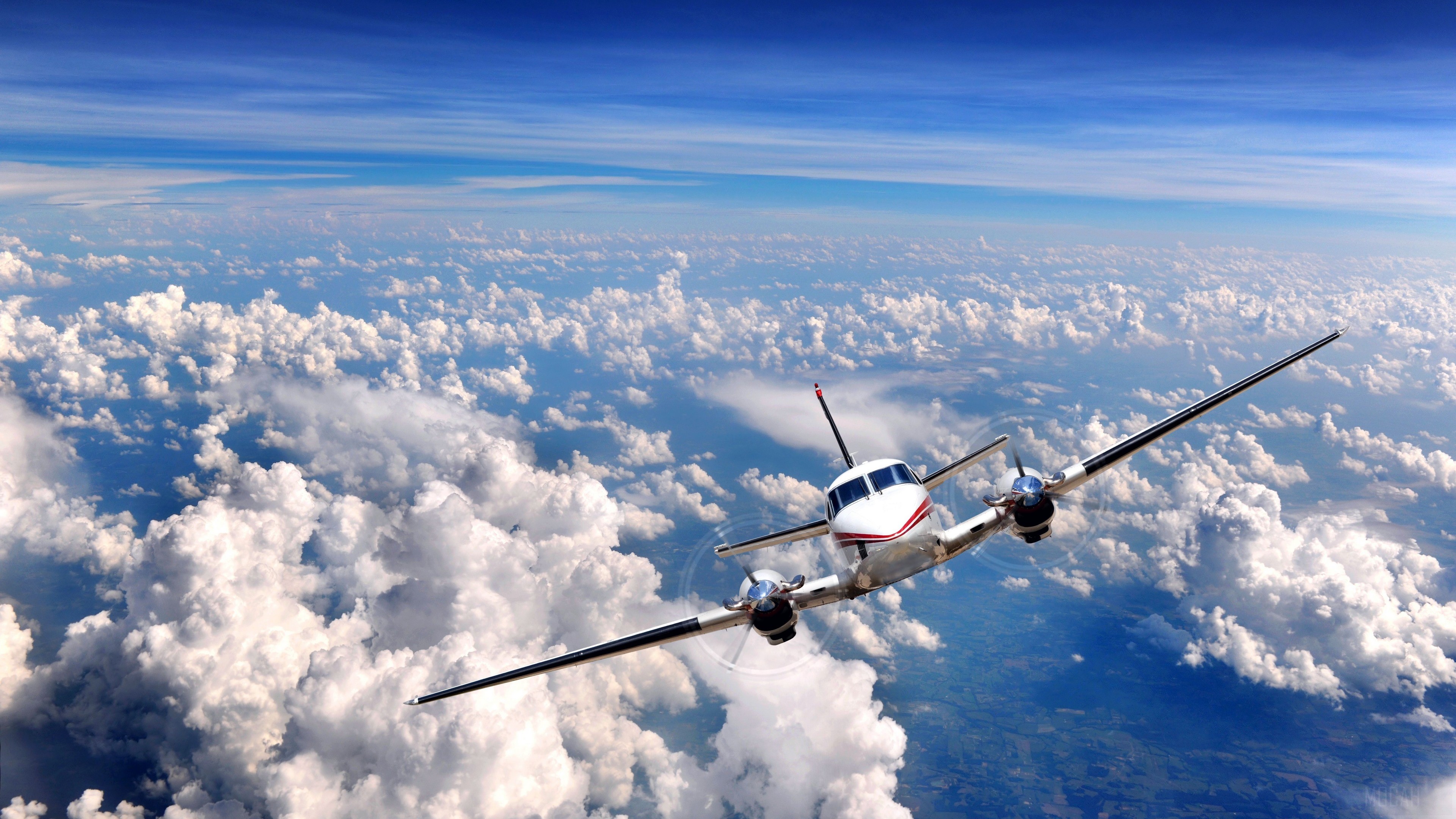 Airplane flying above clouds in 4K HD Wallpaper