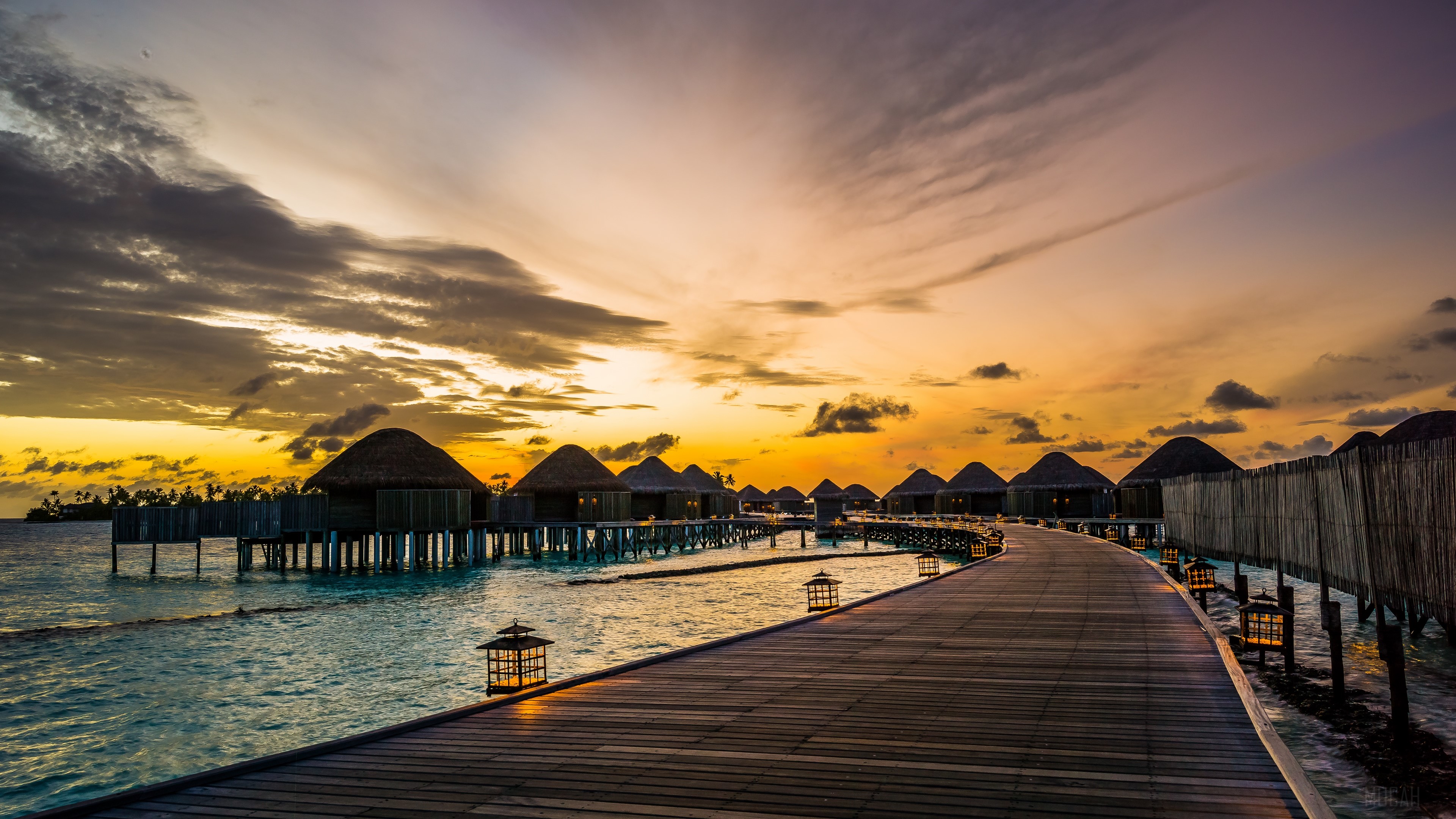 Overwater bungalows at Constance Halaveli Resort, Maldives at sunrise HD Wallpaper
