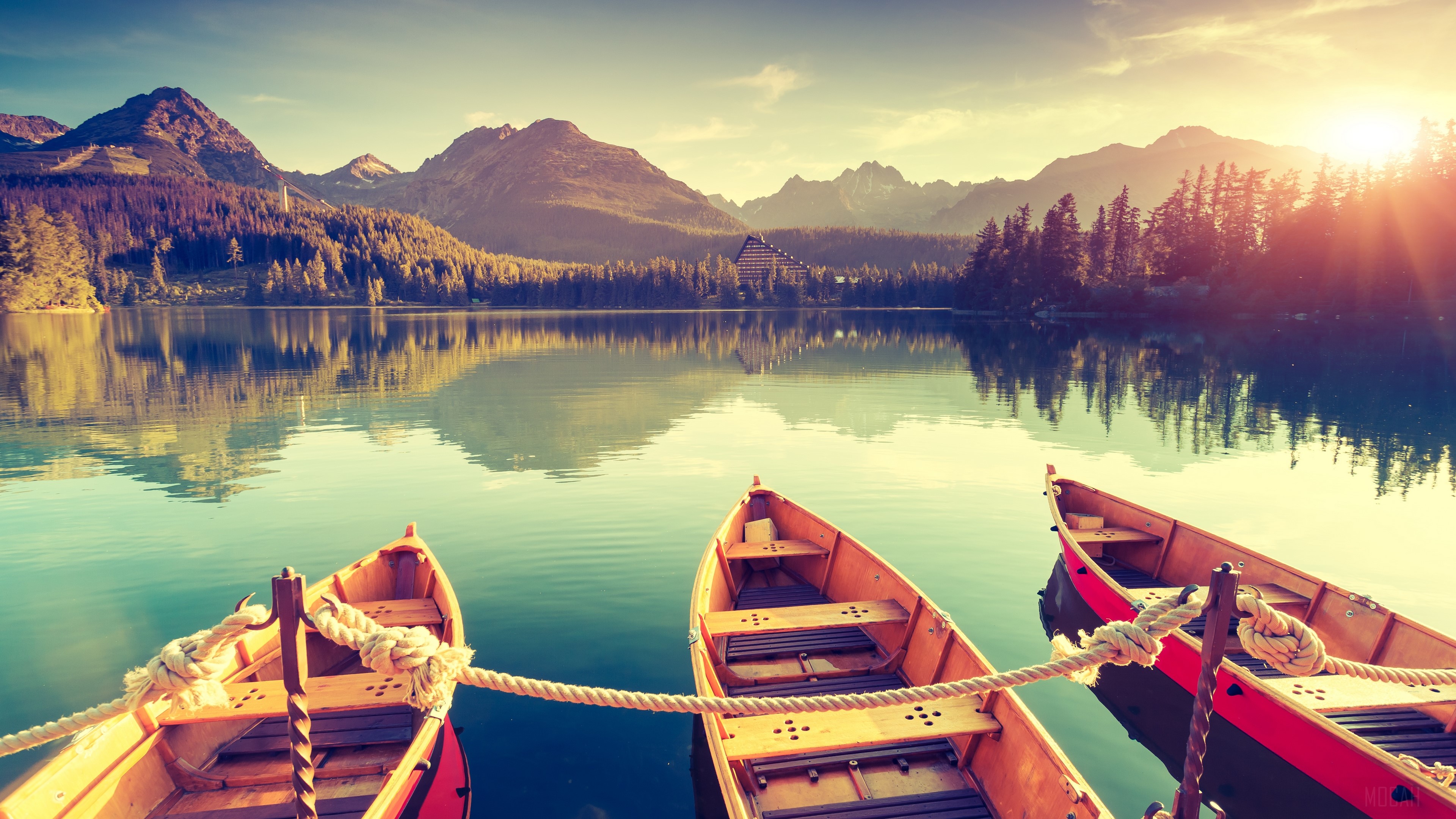 Boats on a lake with mountains and forest HD Wallpaper