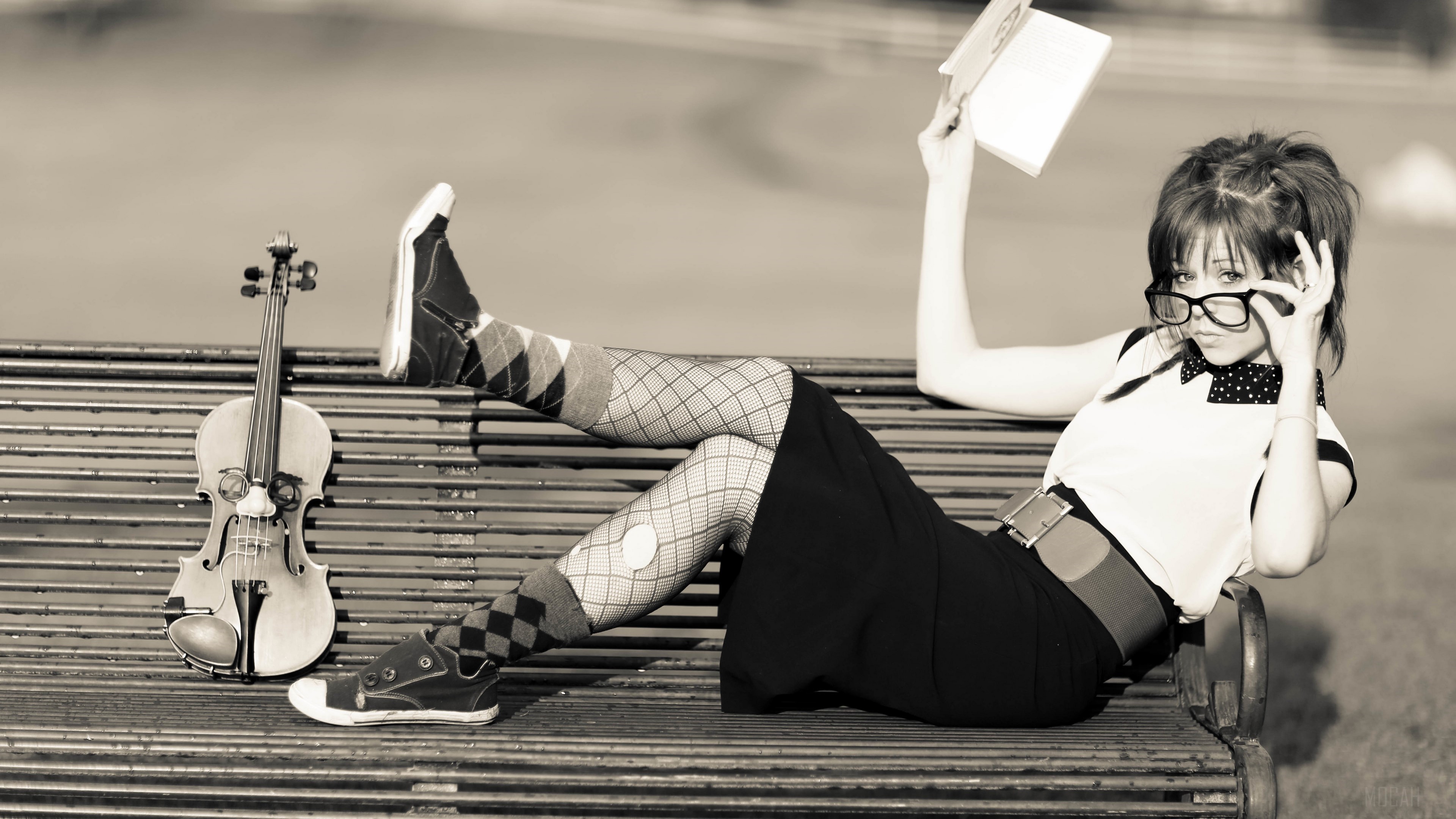 Girl with violin reading a book on a bench HD Wallpaper