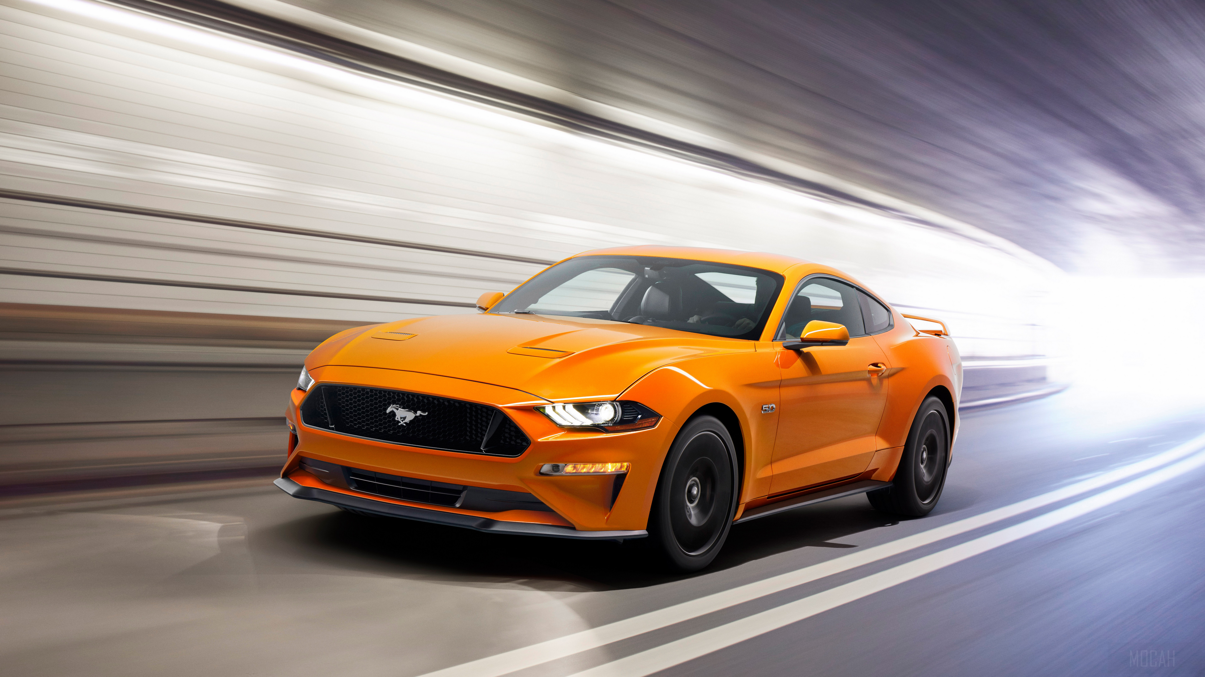 Orange Ford Mustang GT driving through a tunnel HD Wallpaper