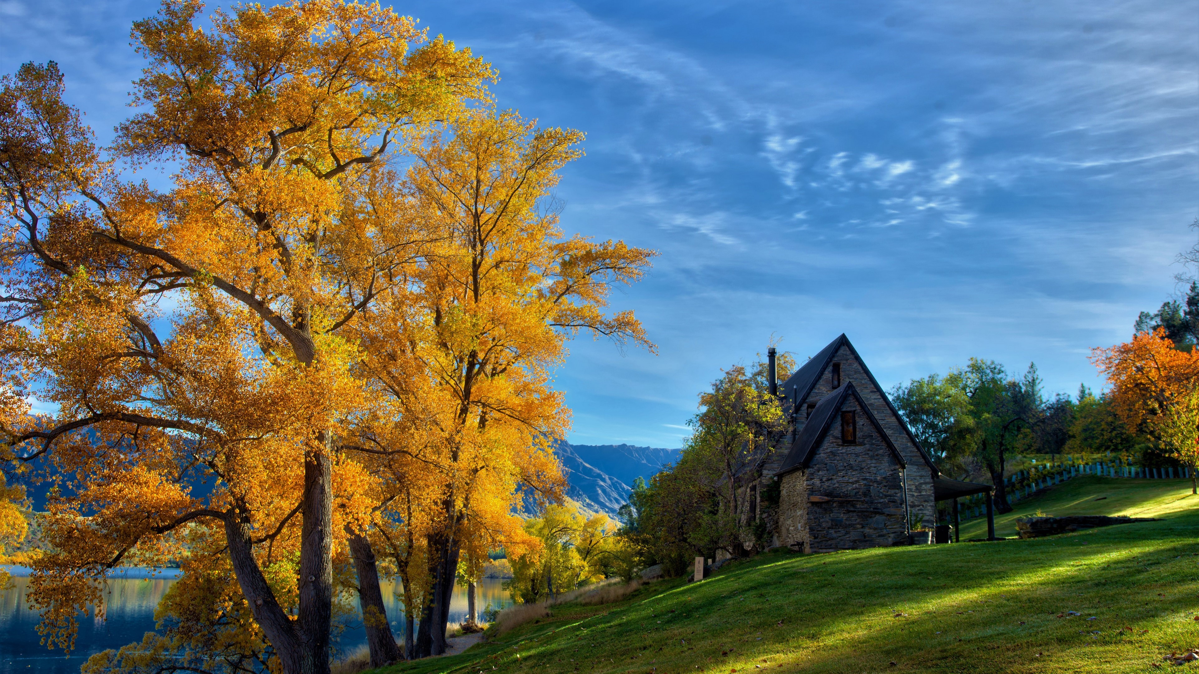 Autumn Tree by Stone House and Lake 4K HD Wallpaper